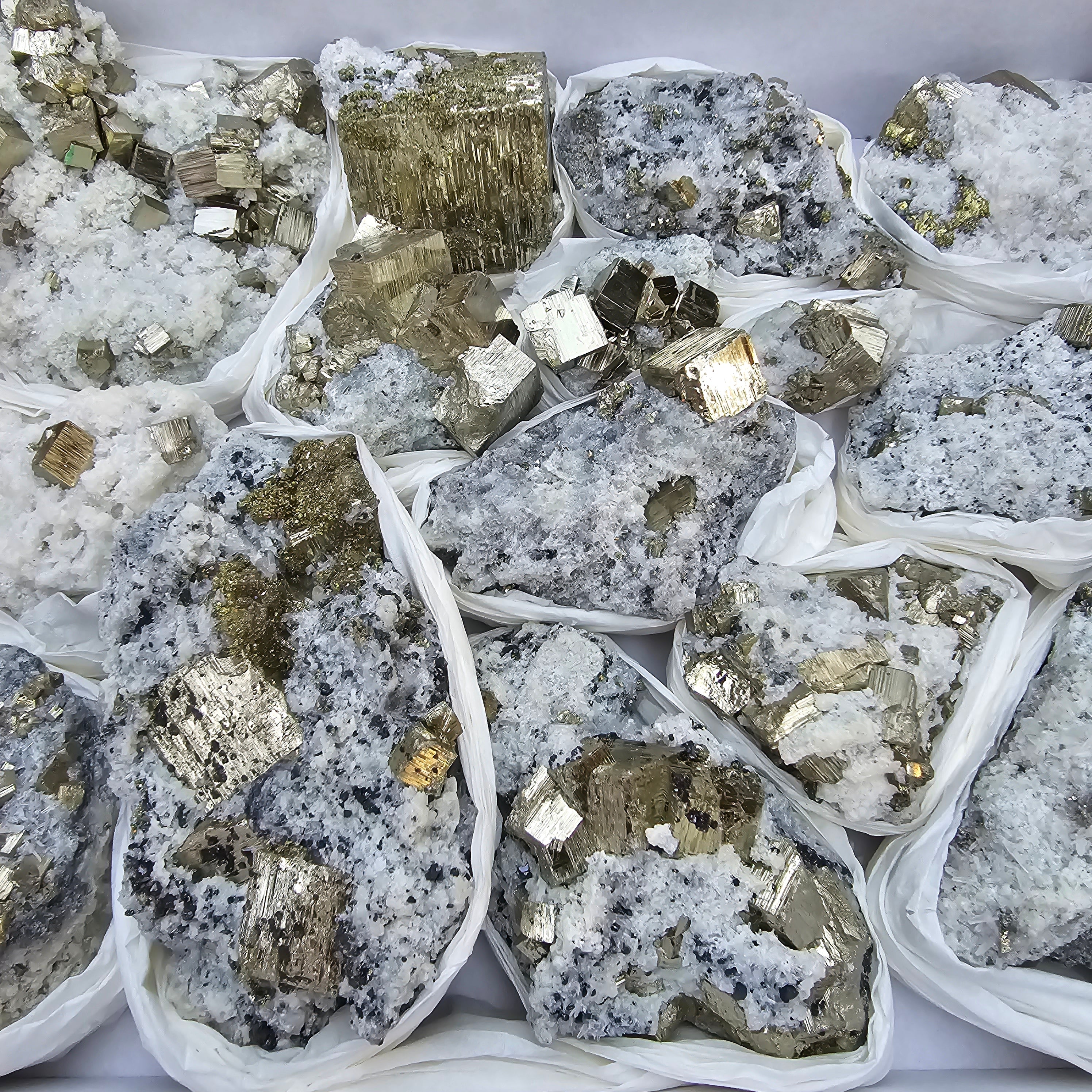 15 pc Pyrite Cubic with calcite flourecent