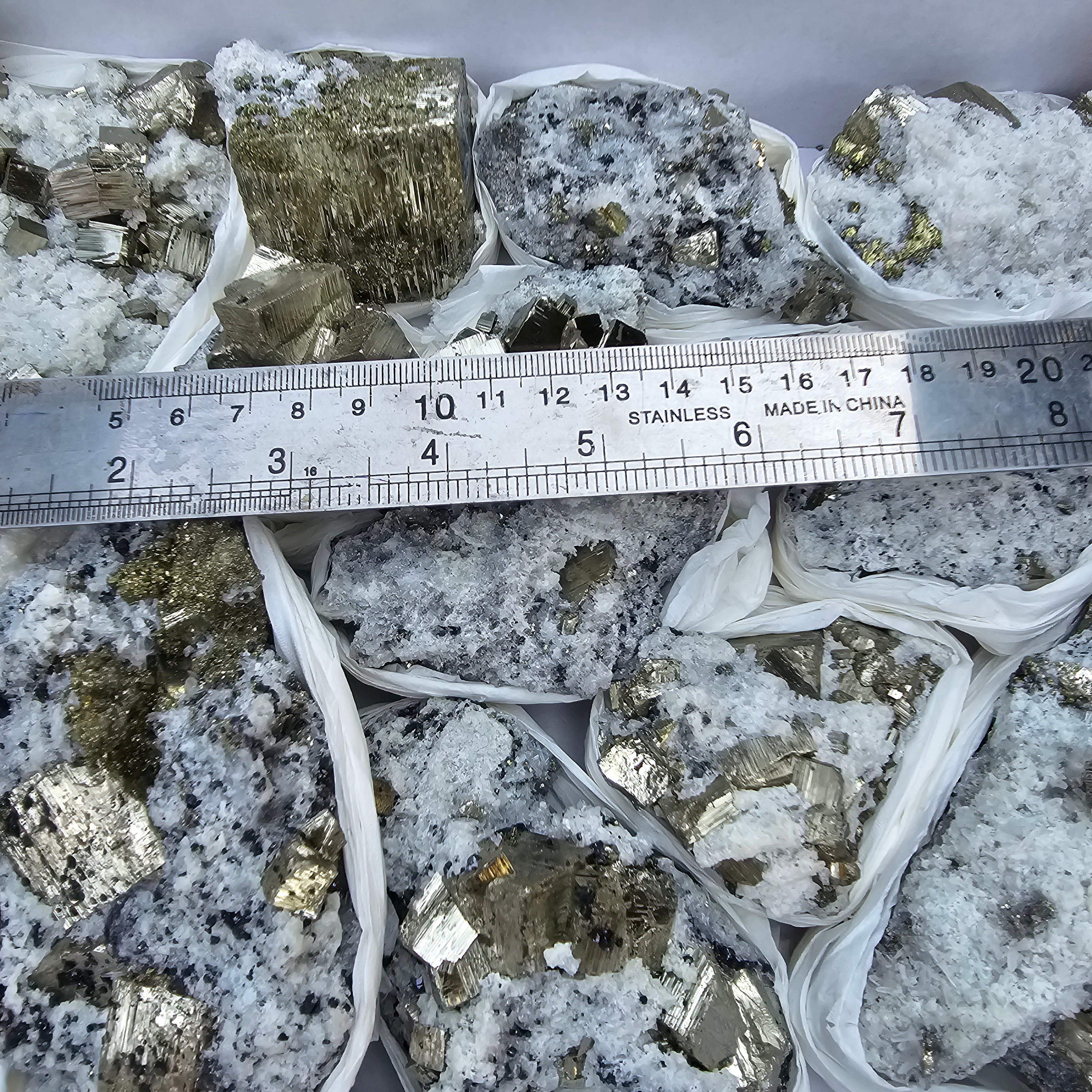 15 pc Pyrite Cubic with calcite flourecent