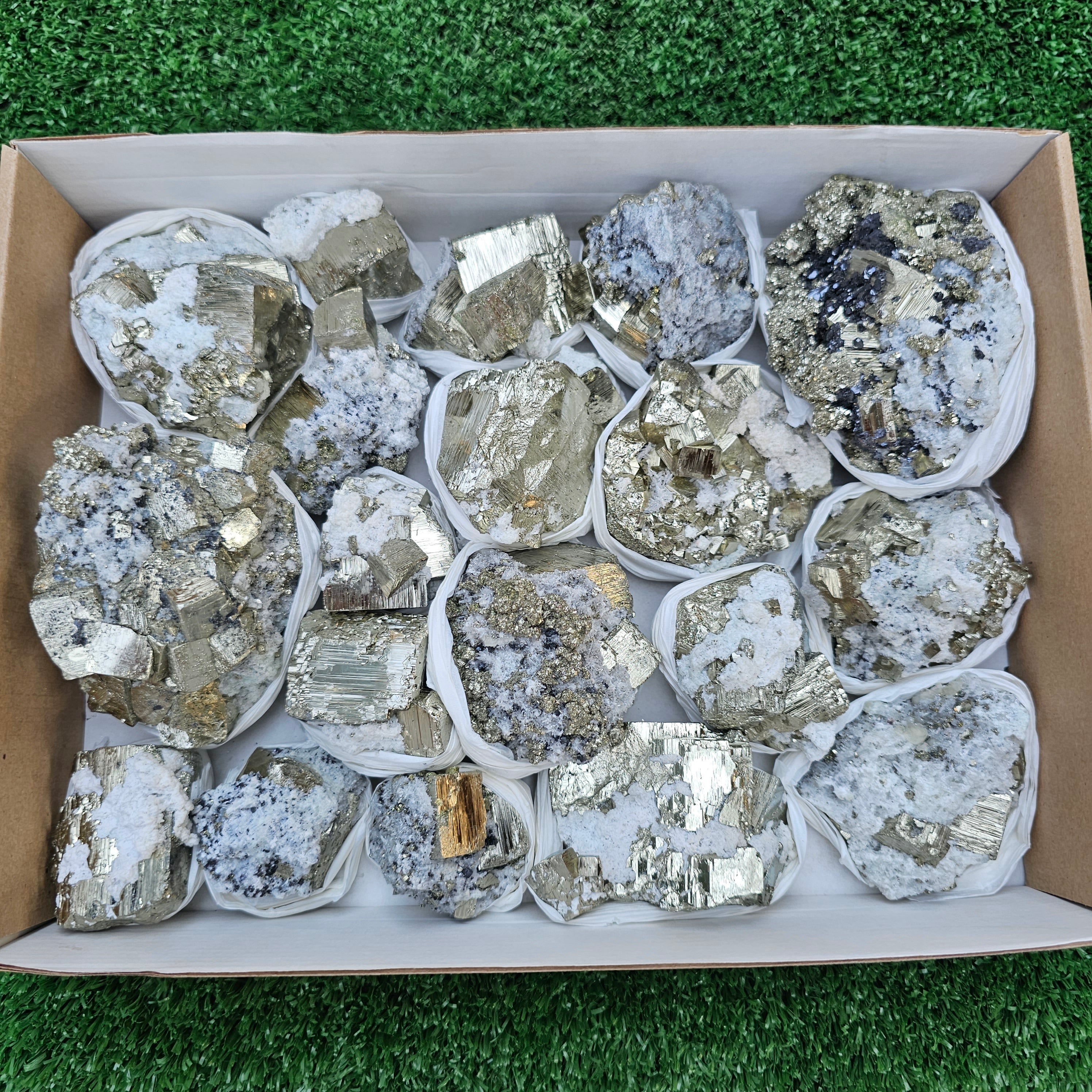 19 pc Pyrite Cubic with calcite flourecent