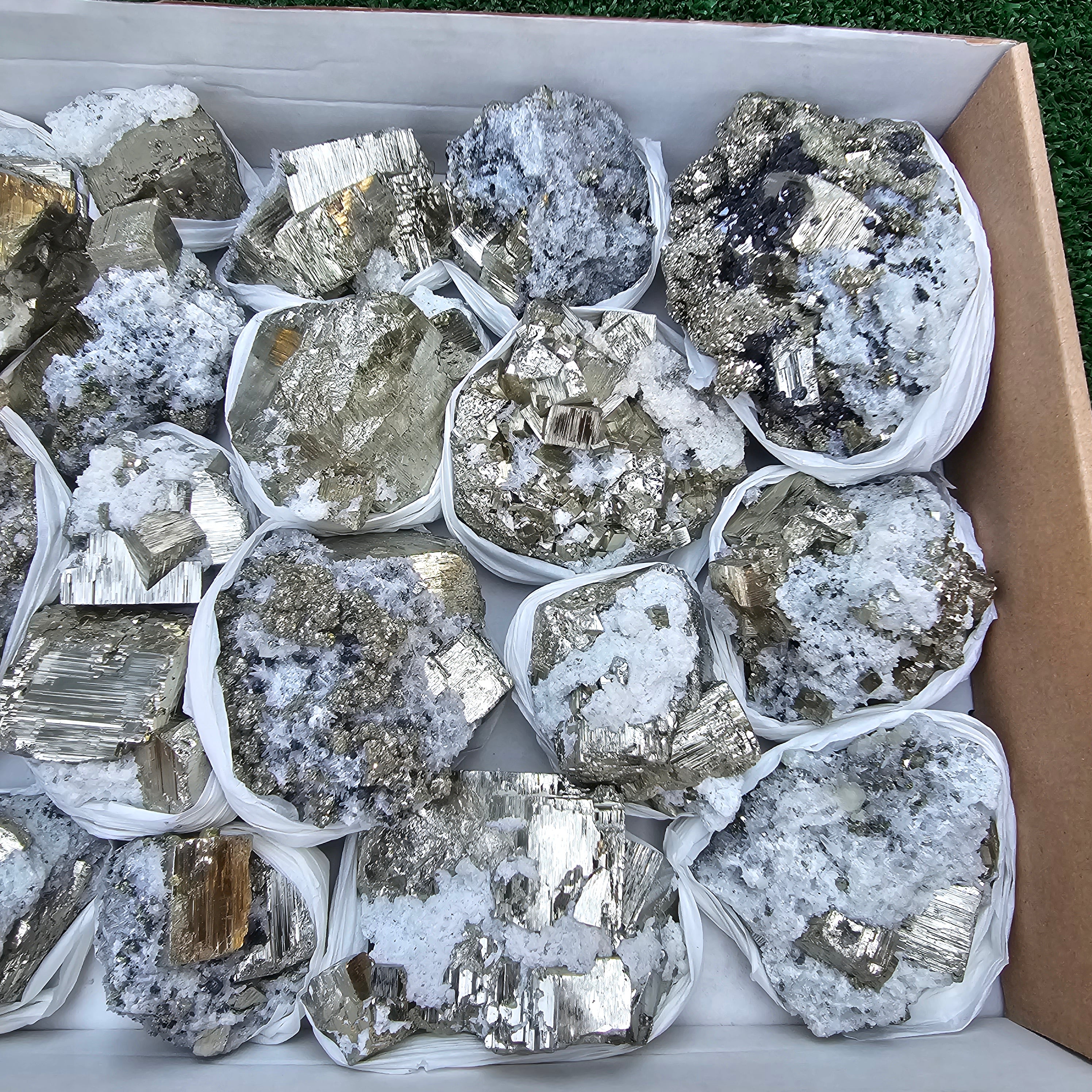 19 pc Pyrite Cubic with calcite flourecent