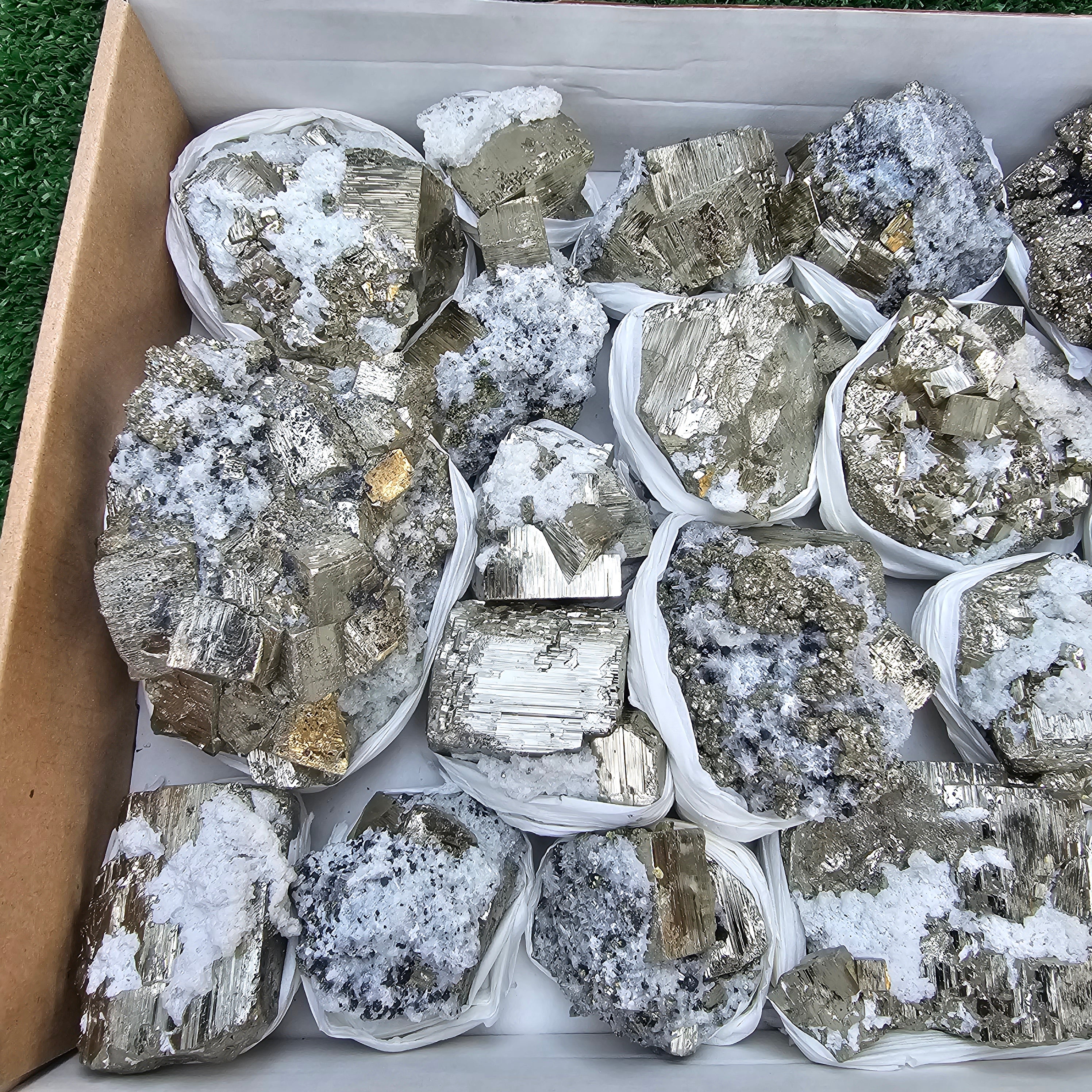 19 pc Pyrite Cubic with calcite flourecent
