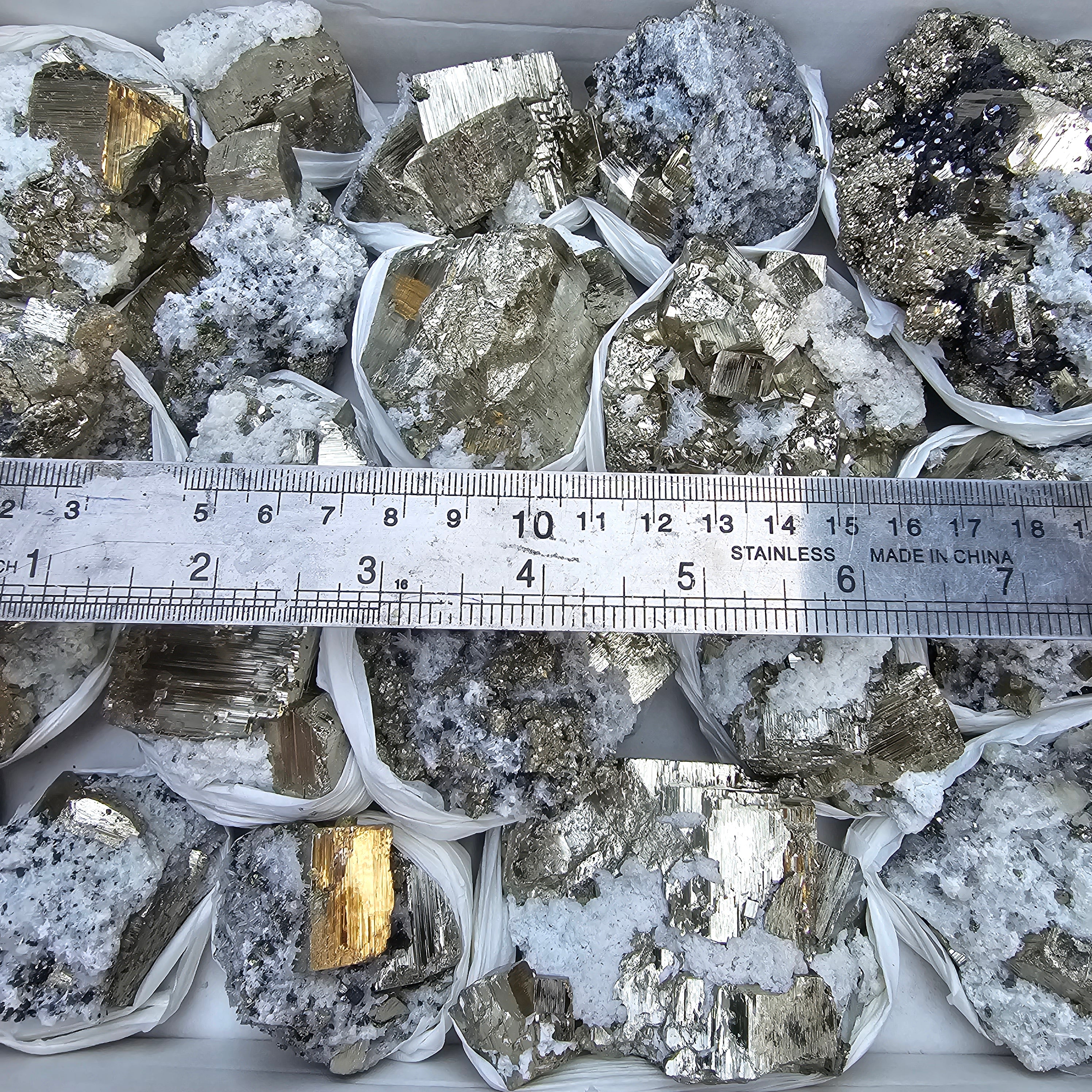 19 pc Pyrite Cubic with calcite flourecent