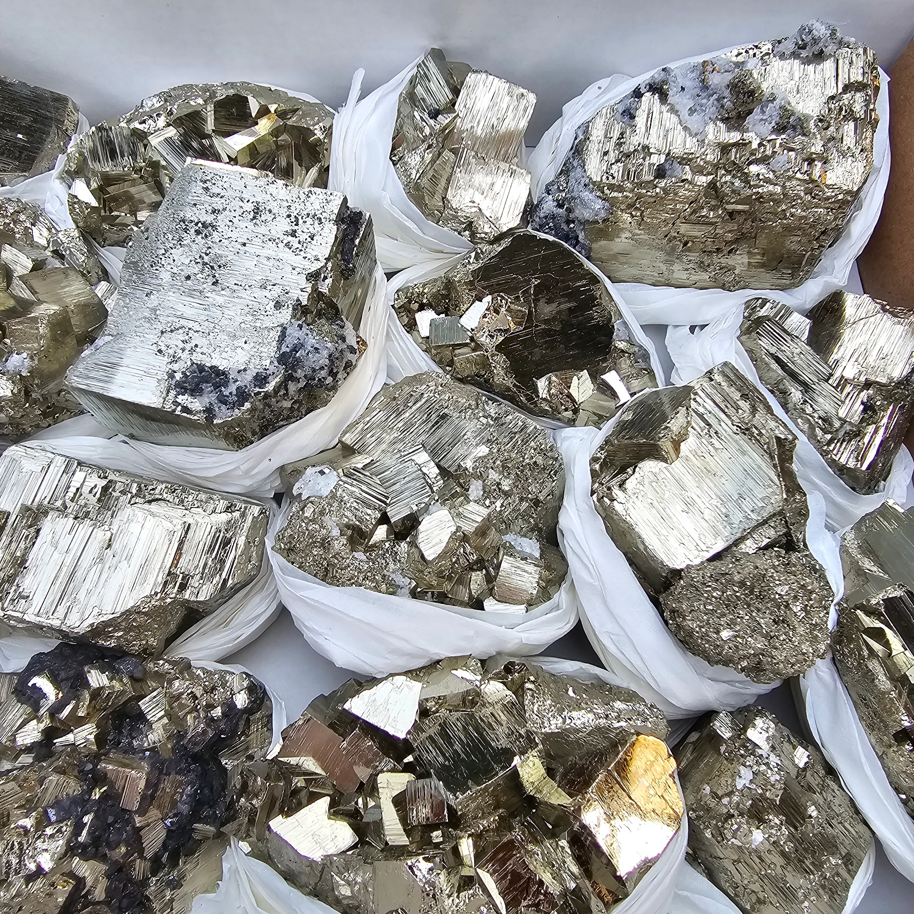 17 pc Pyrite Cubic with calcite flourecent