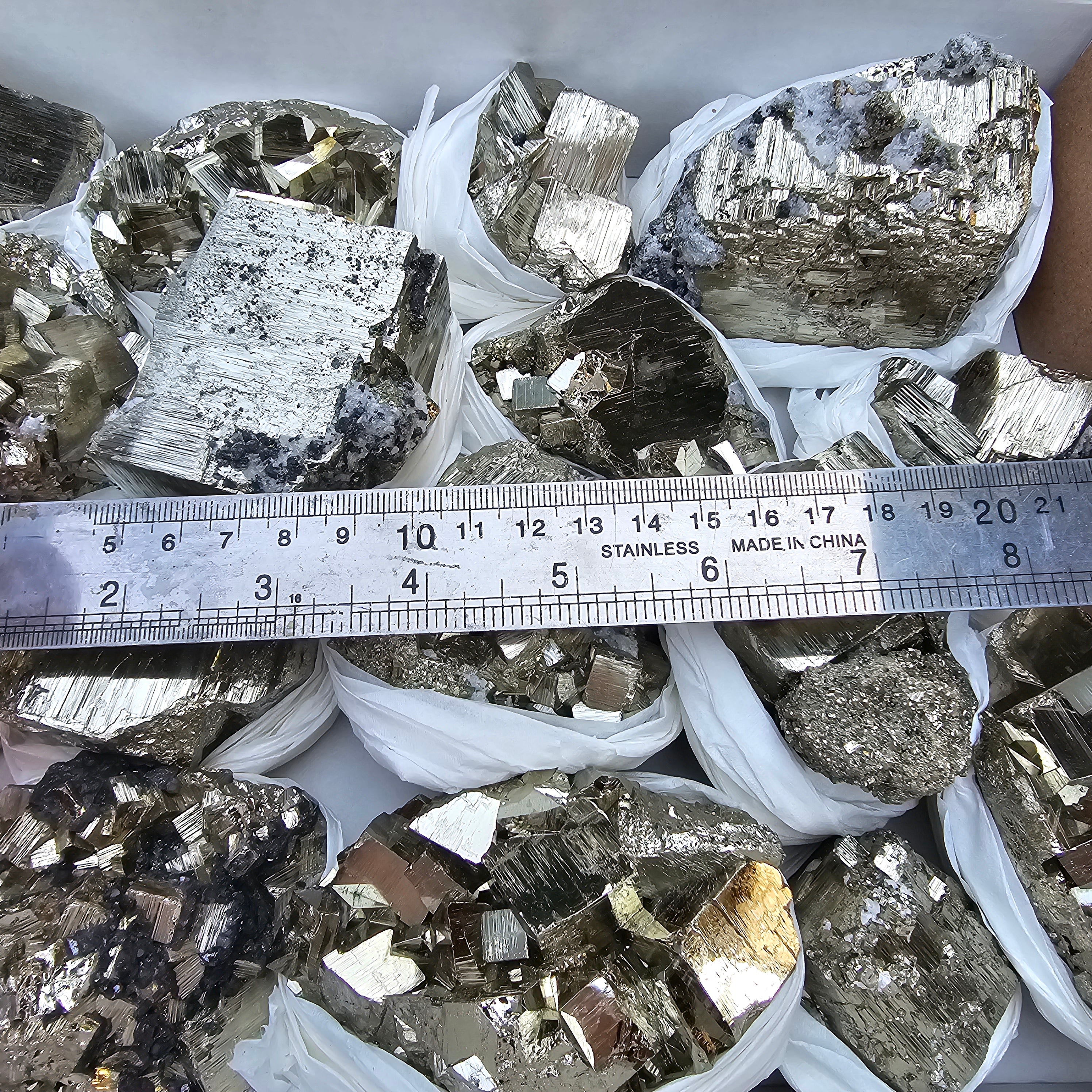 17 pc Pyrite Cubic with calcite flourecent