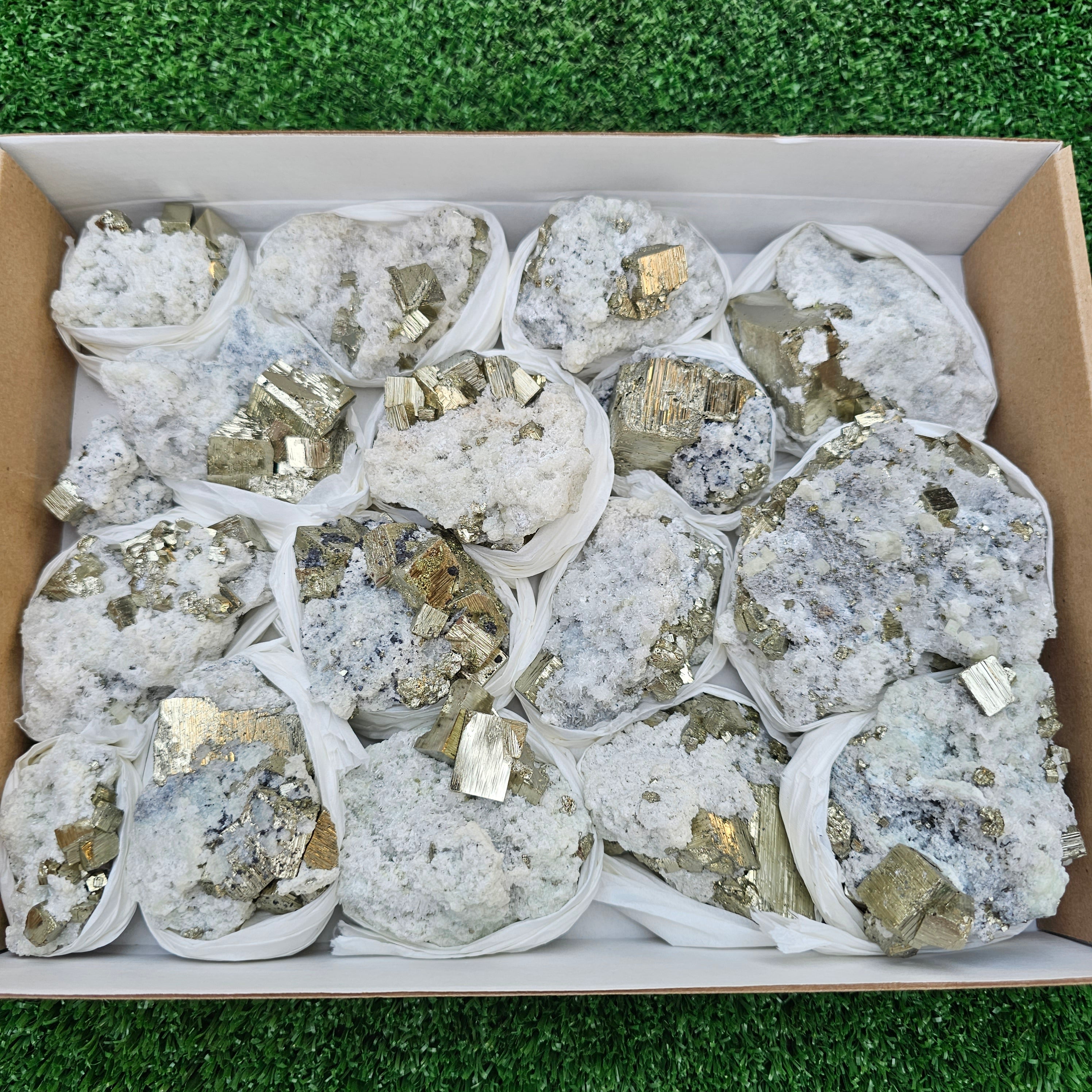 17 pc Pyrite Cubic with calcite flourecent