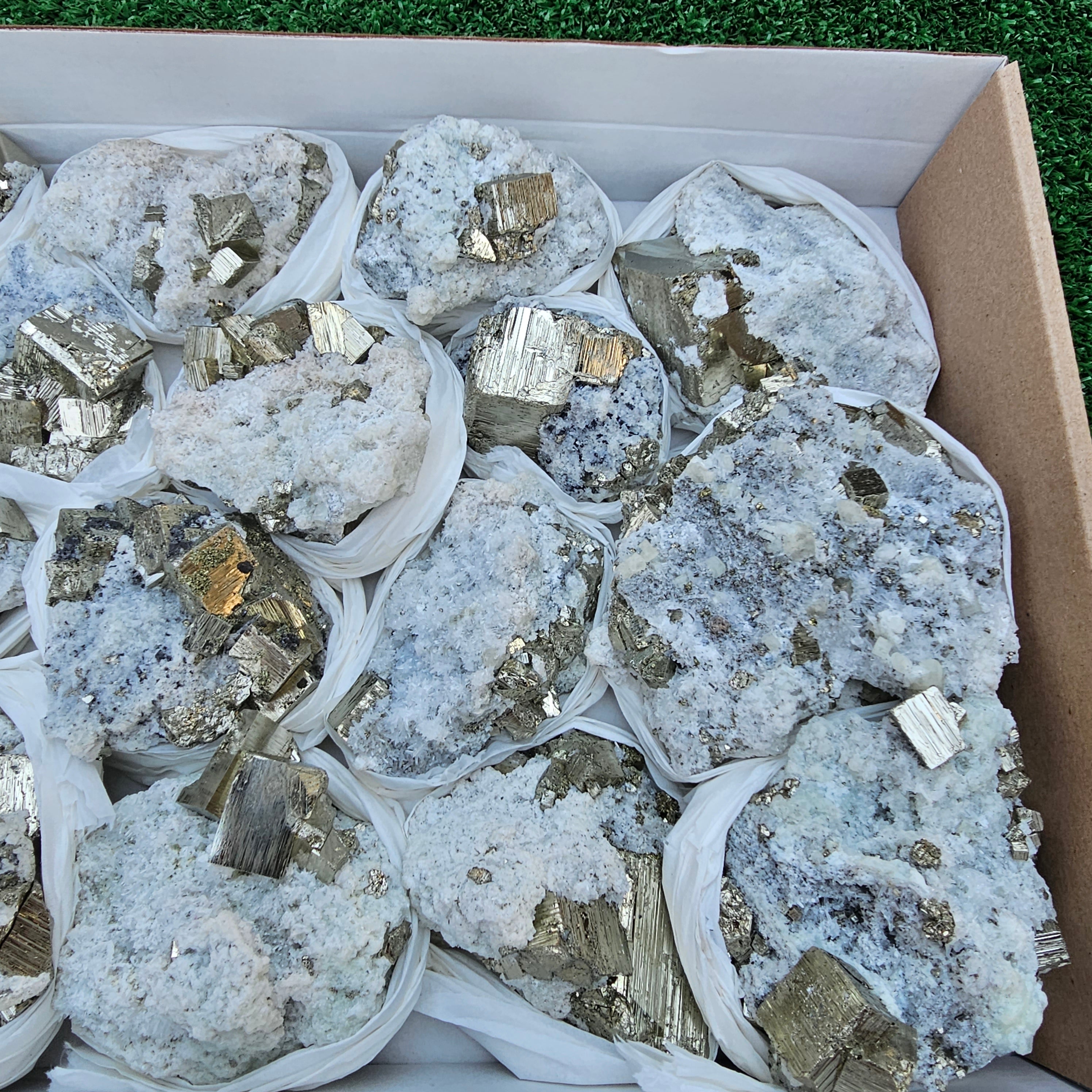 17 pc Pyrite Cubic with calcite flourecent