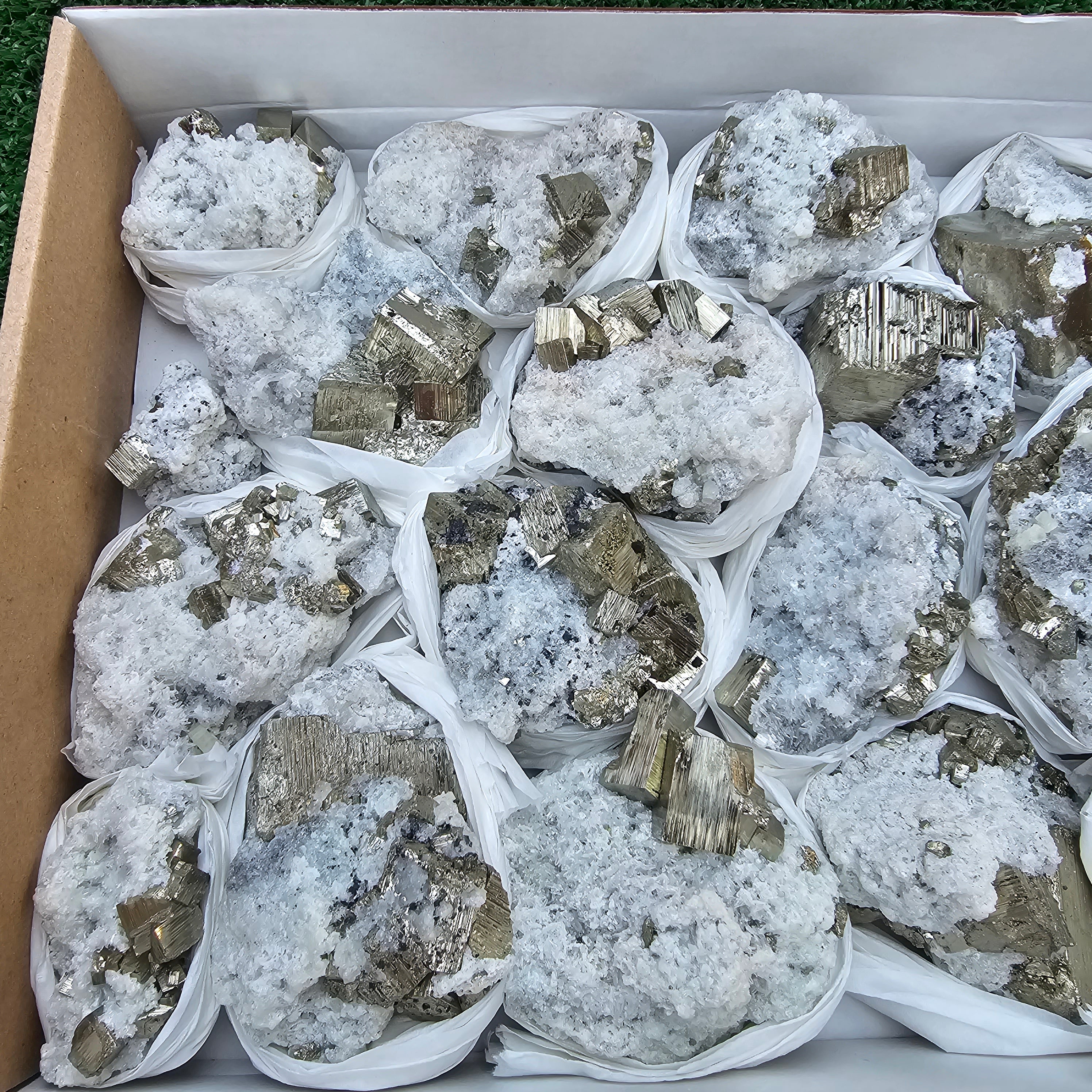 17 pc Pyrite Cubic with calcite flourecent