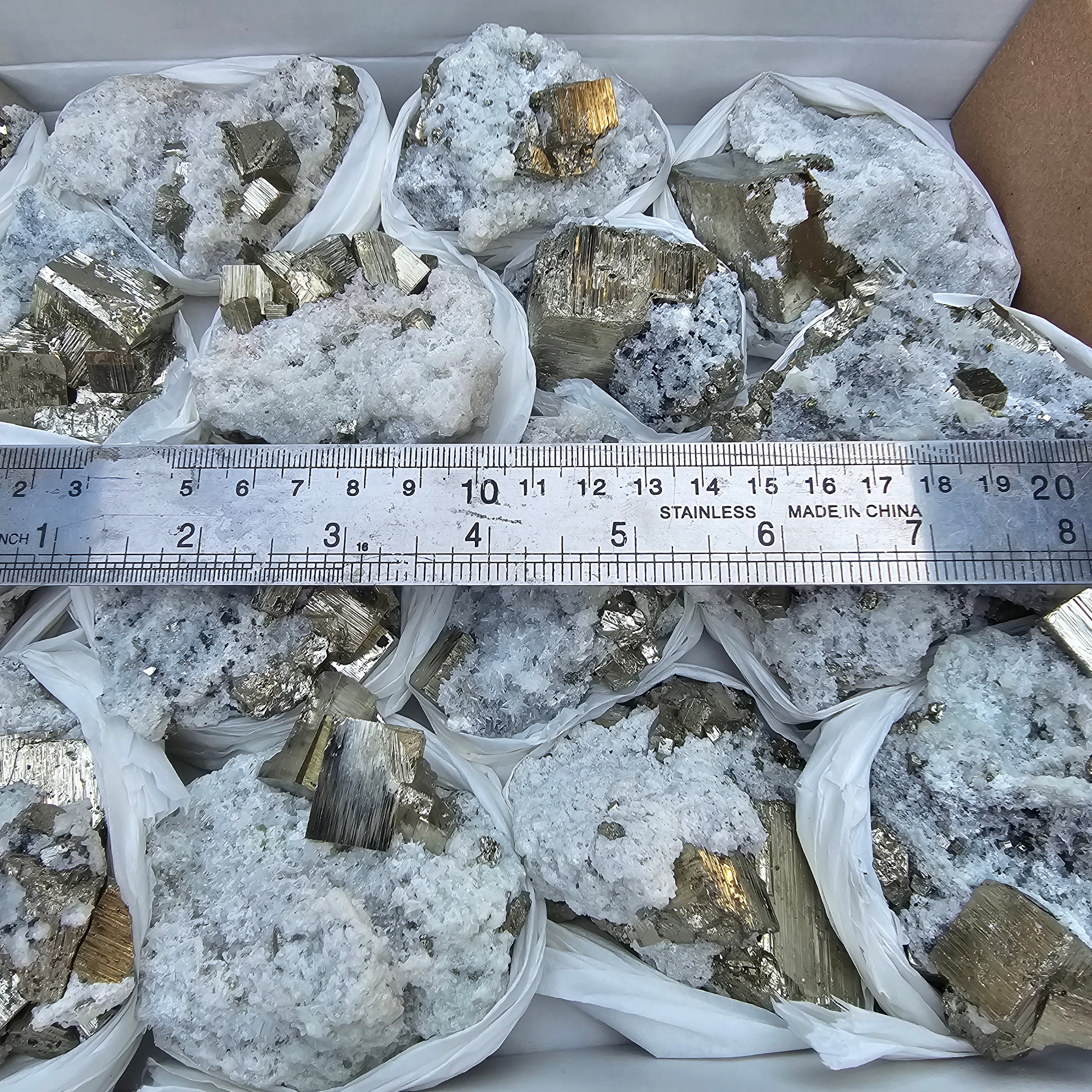 17 pc Pyrite Cubic with calcite flourecent