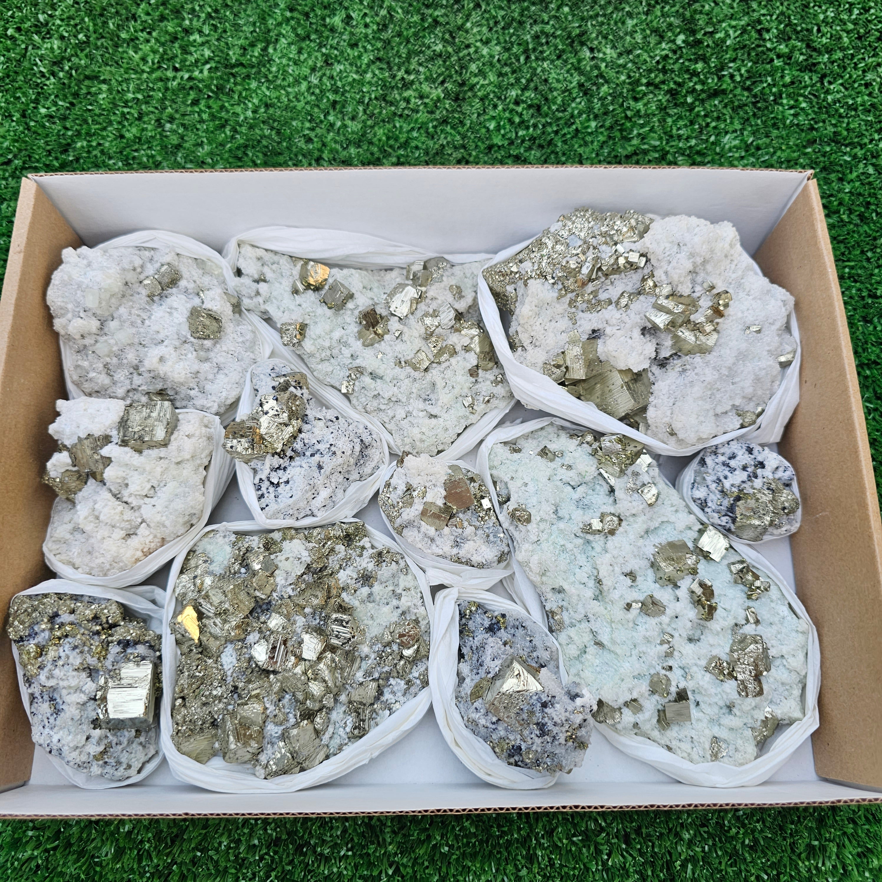 12 pc Pyrite Cubic with calcite flourecent