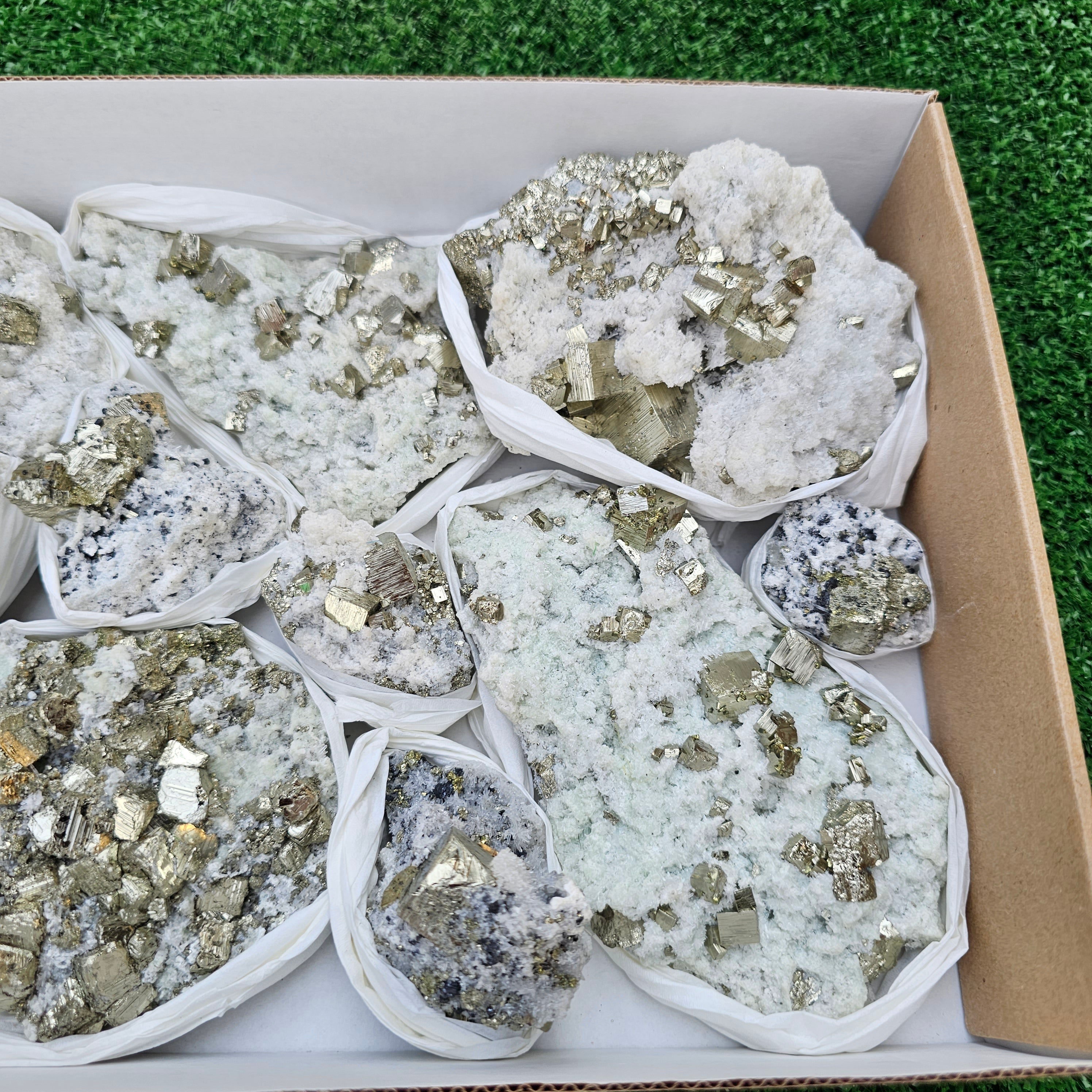 12 pc Pyrite Cubic with calcite flourecent