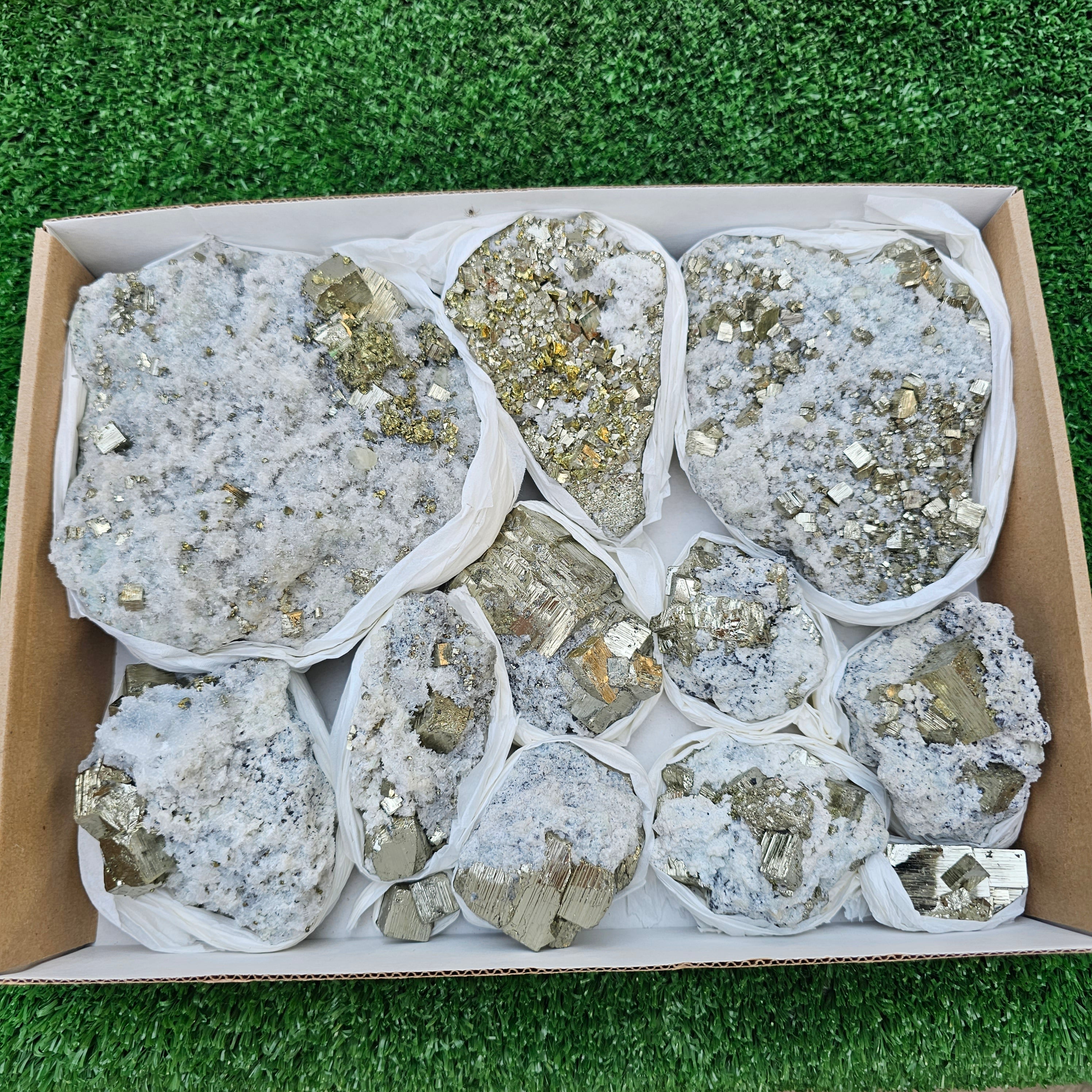 11 pc Pyrite Cubic with calcite flourecent