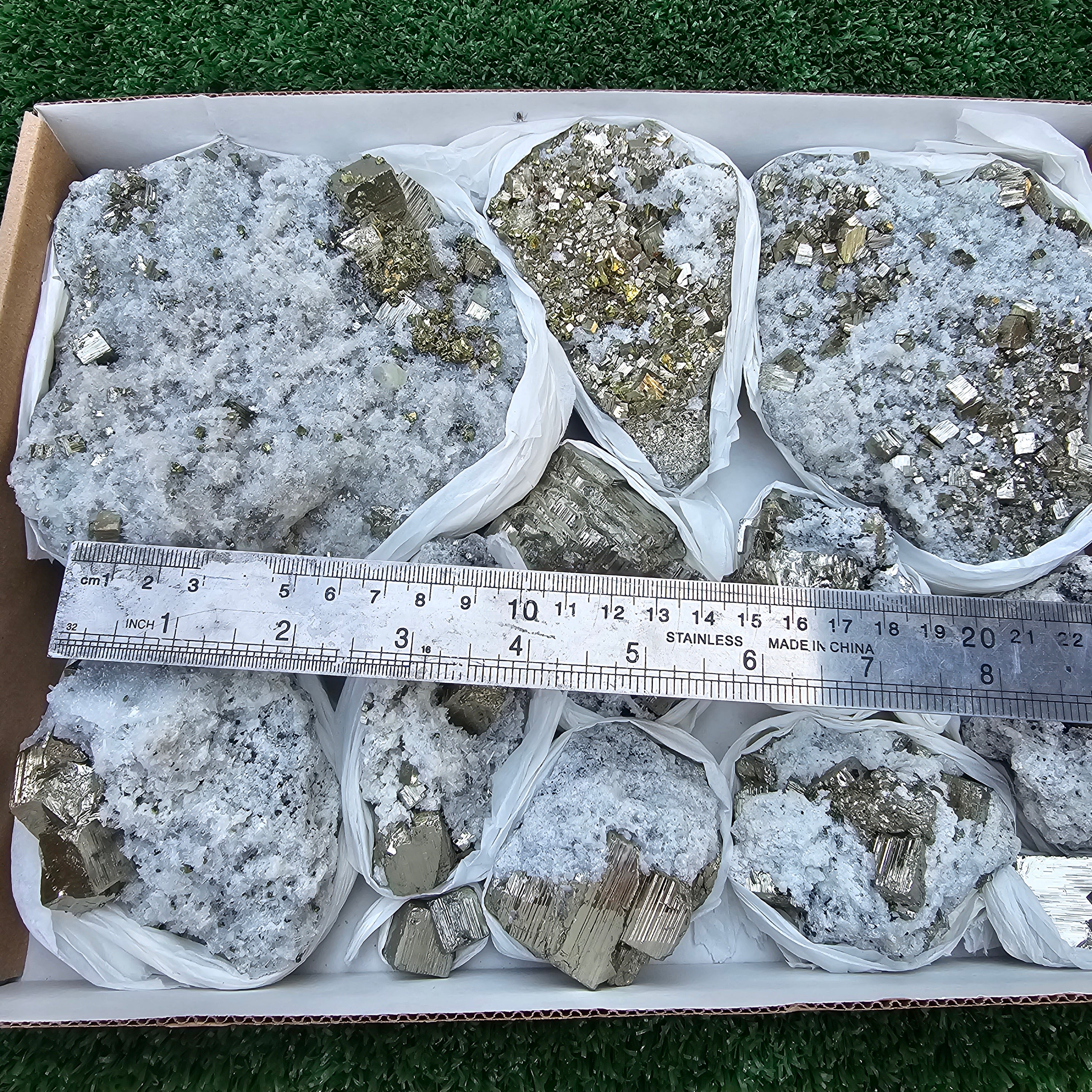 11 pc Pyrite Cubic with calcite flourecent