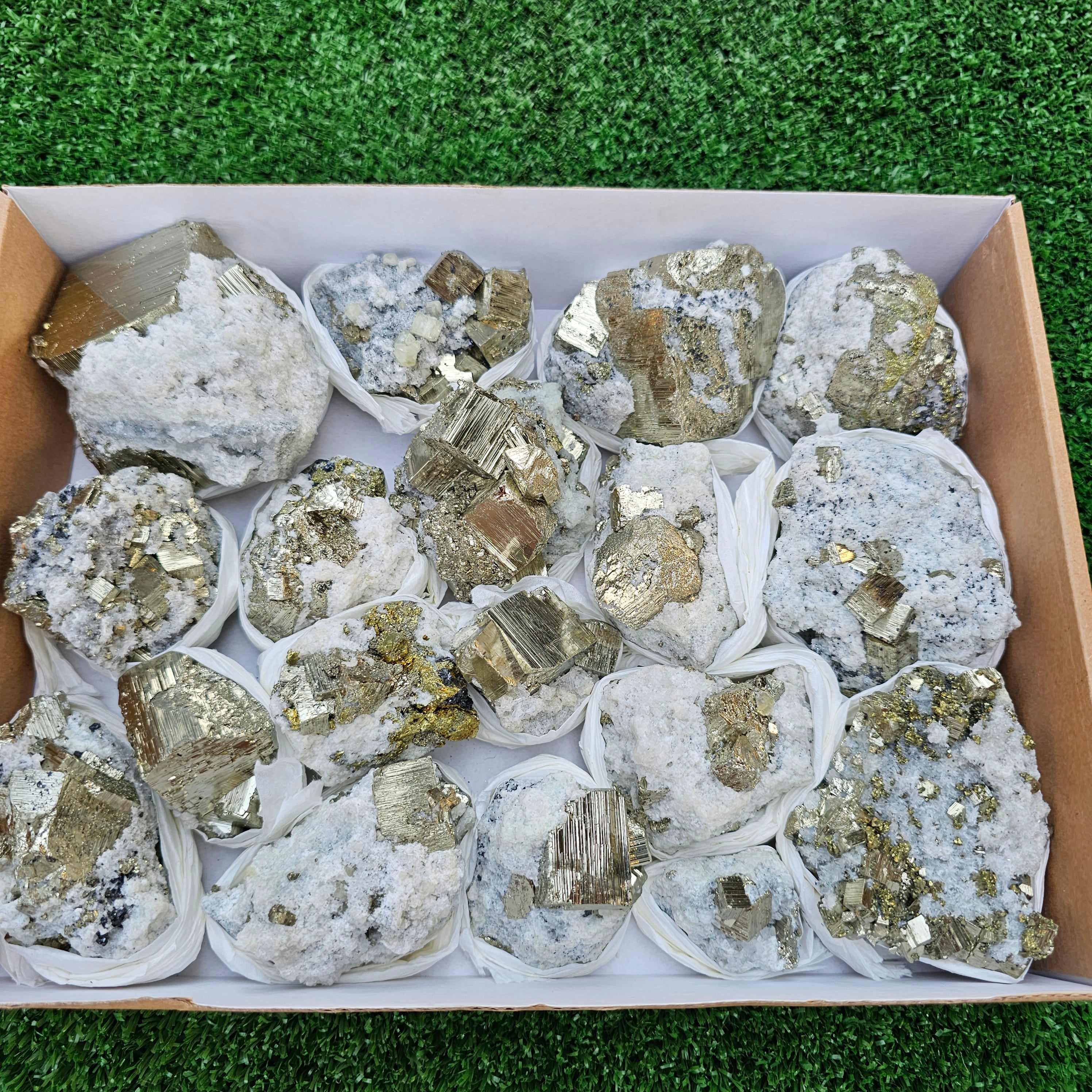 18 pc Pyrite Cubic with calcite flourecent