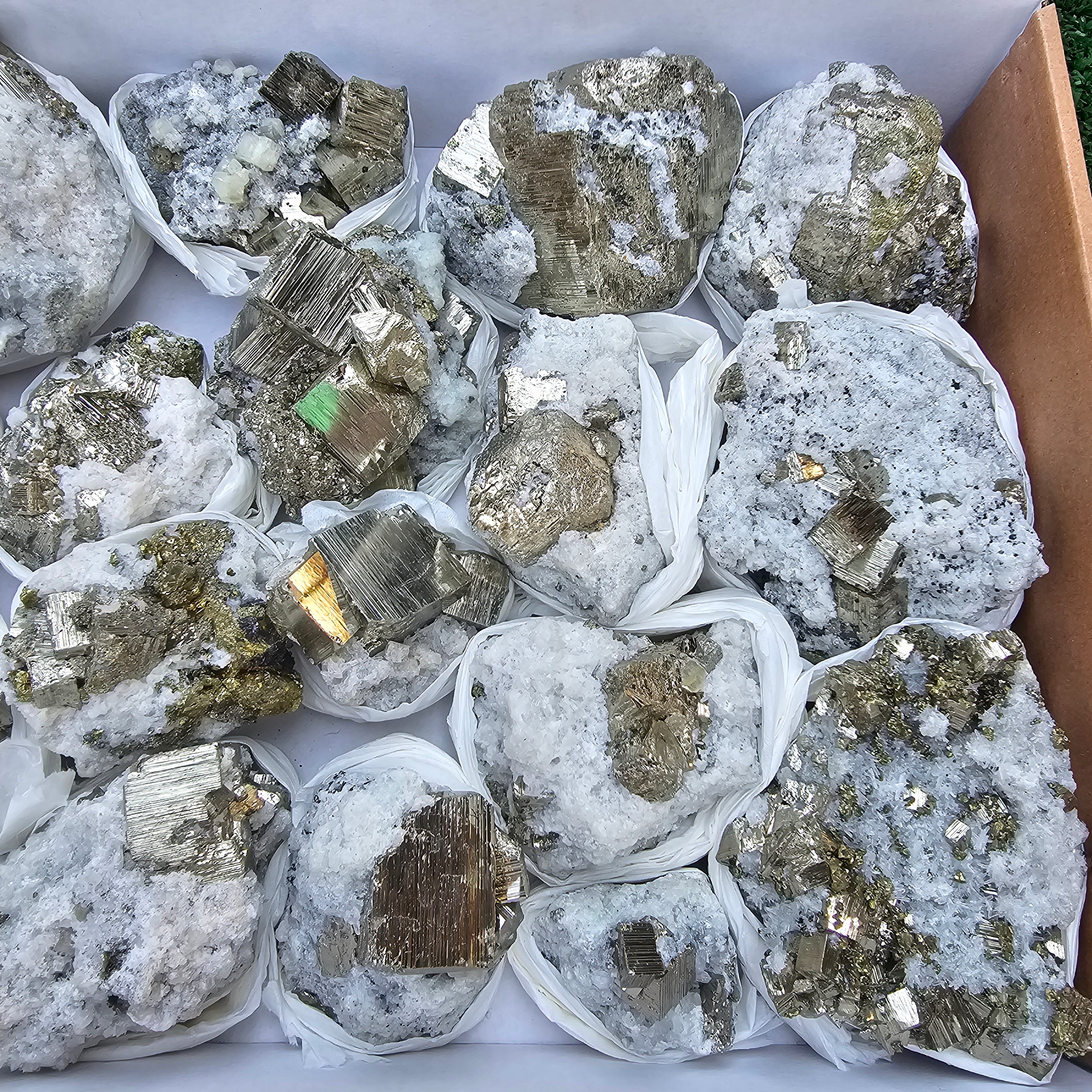 18 pc Pyrite Cubic with calcite flourecent