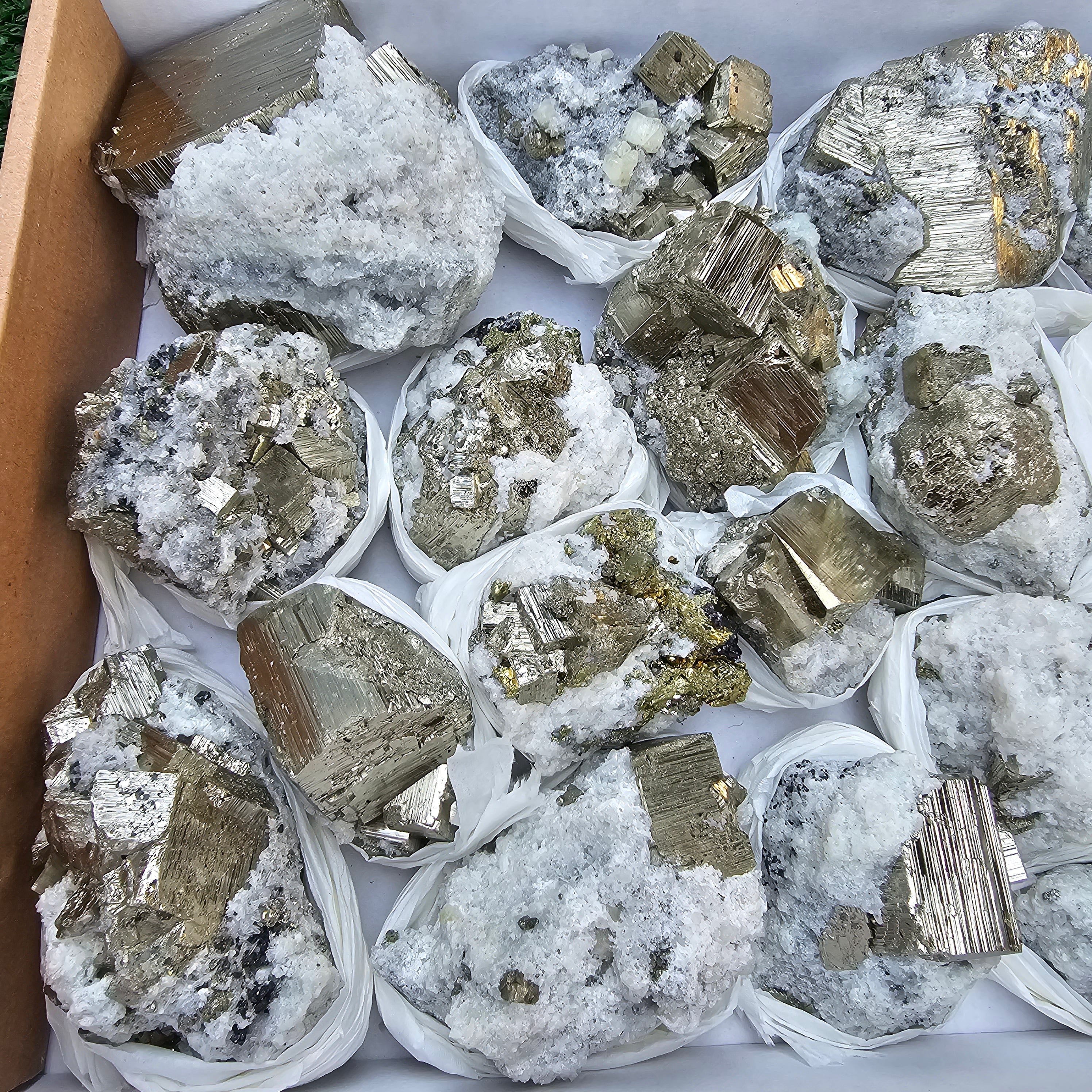 18 pc Pyrite Cubic with calcite flourecent