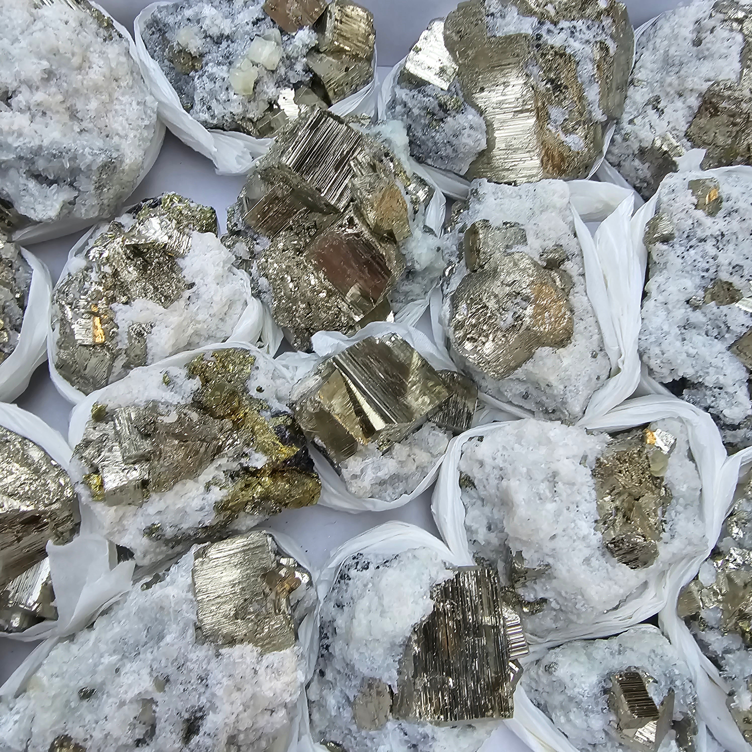 18 pc Pyrite Cubic with calcite flourecent