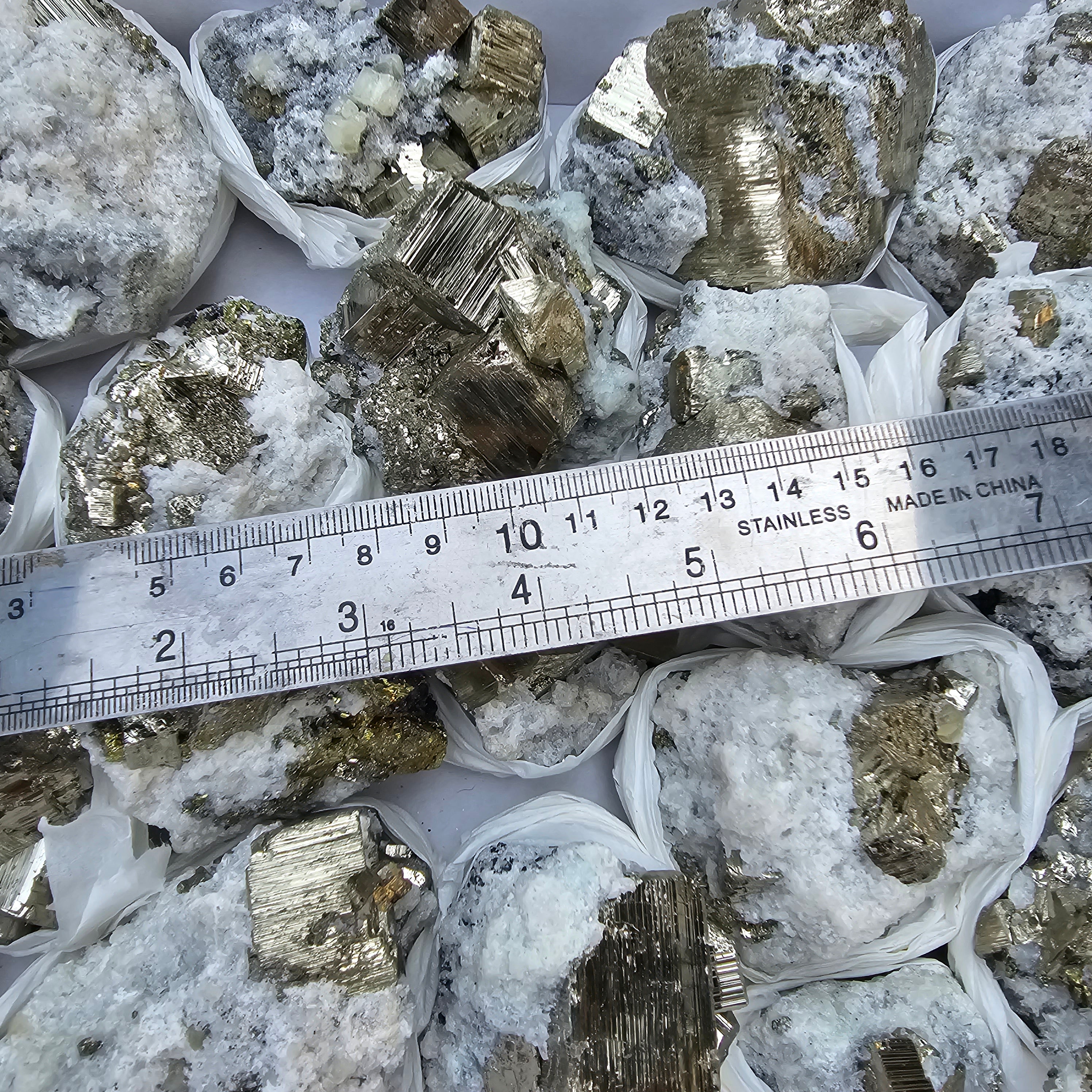18 pc Pyrite Cubic with calcite flourecent
