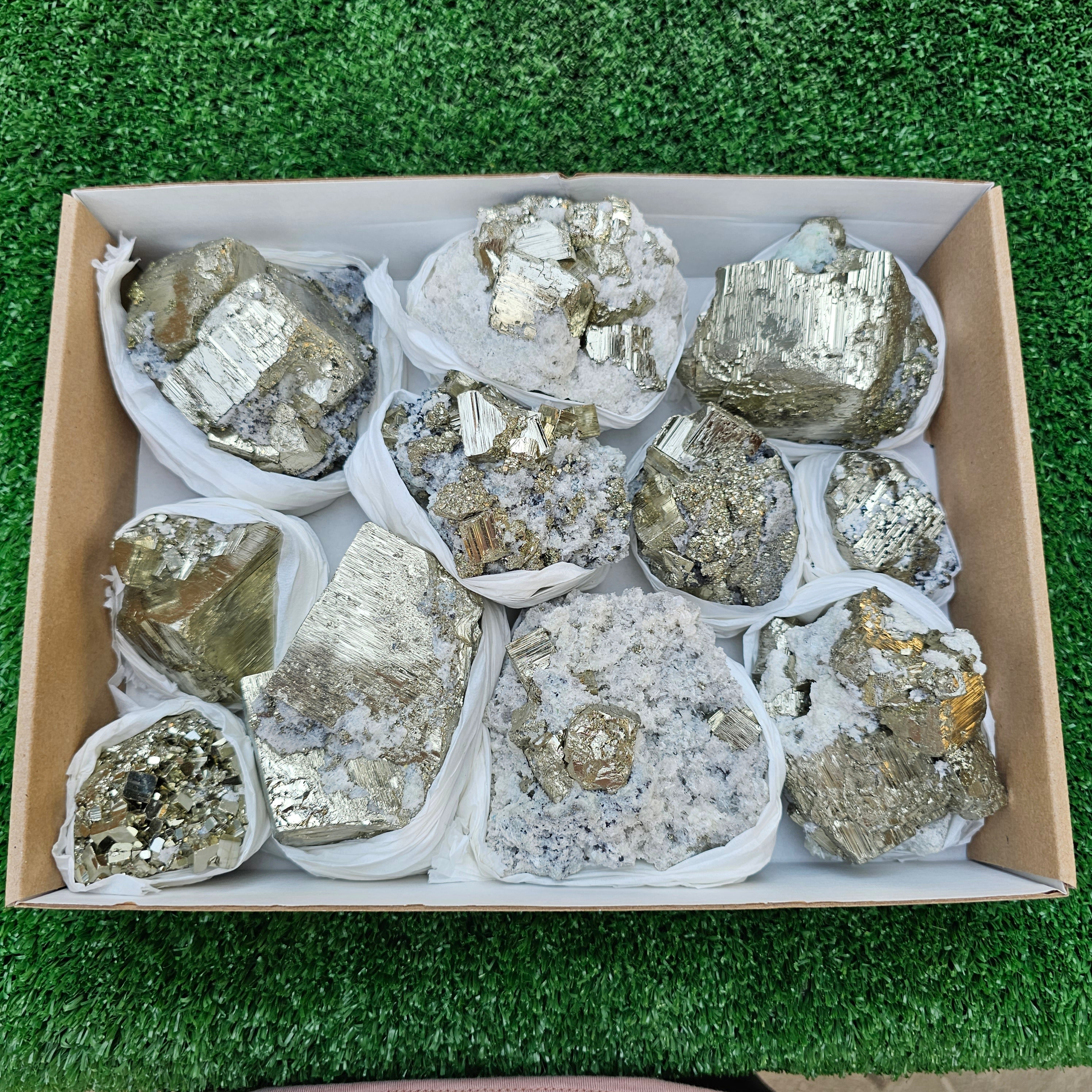 11 pc Pyrite Cubic with calcite flourecent