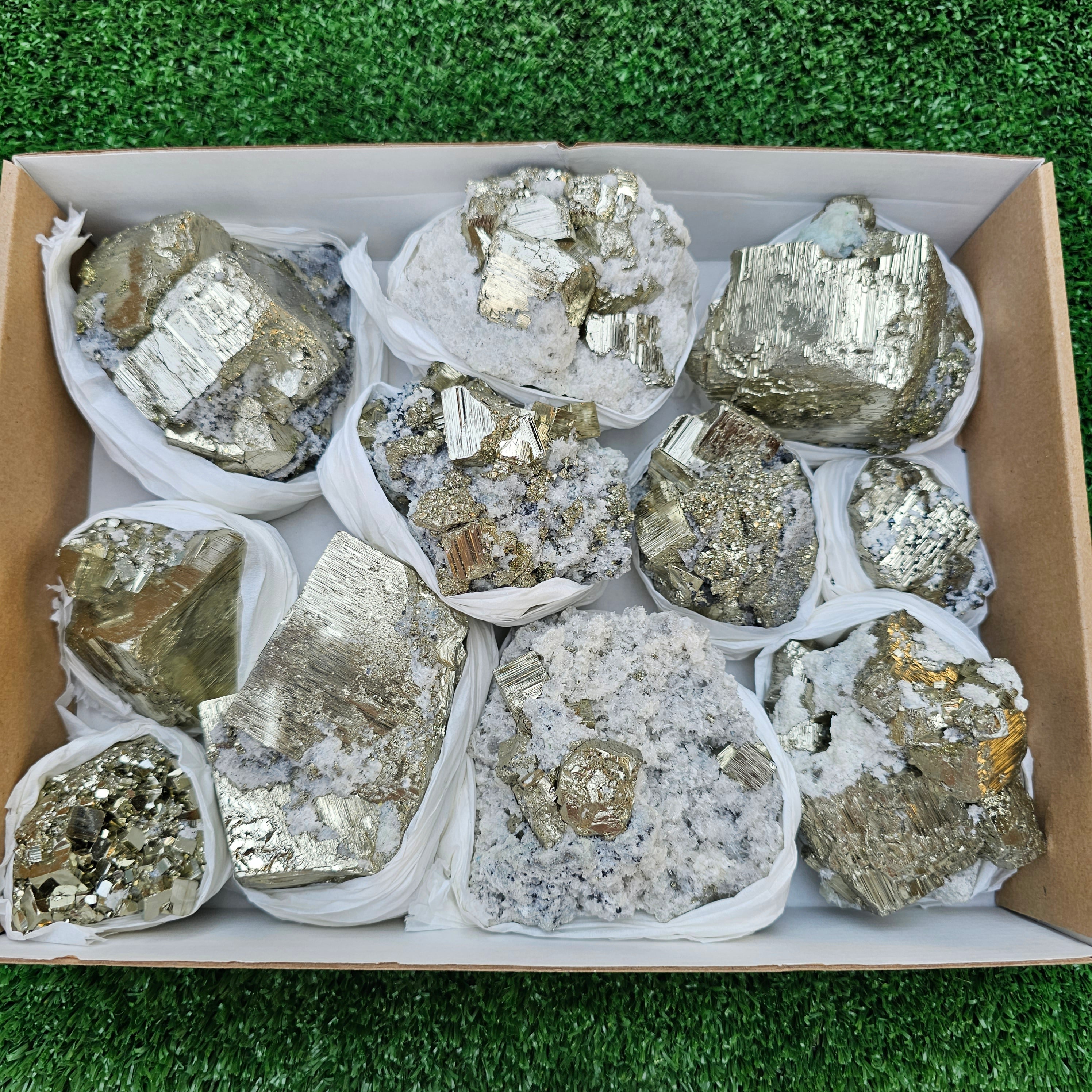 11 pc Pyrite Cubic with calcite flourecent