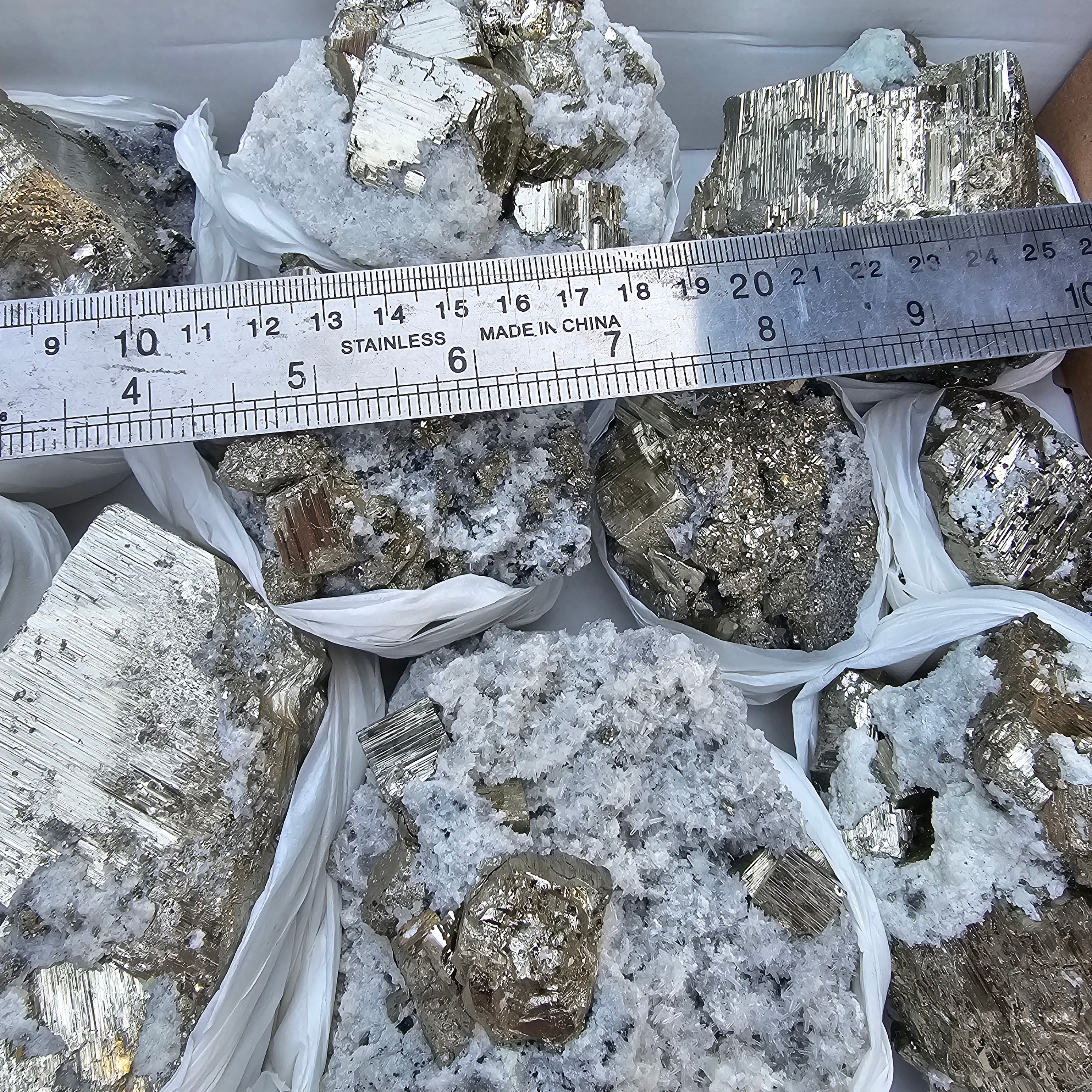 11 pc Pyrite Cubic with calcite flourecent