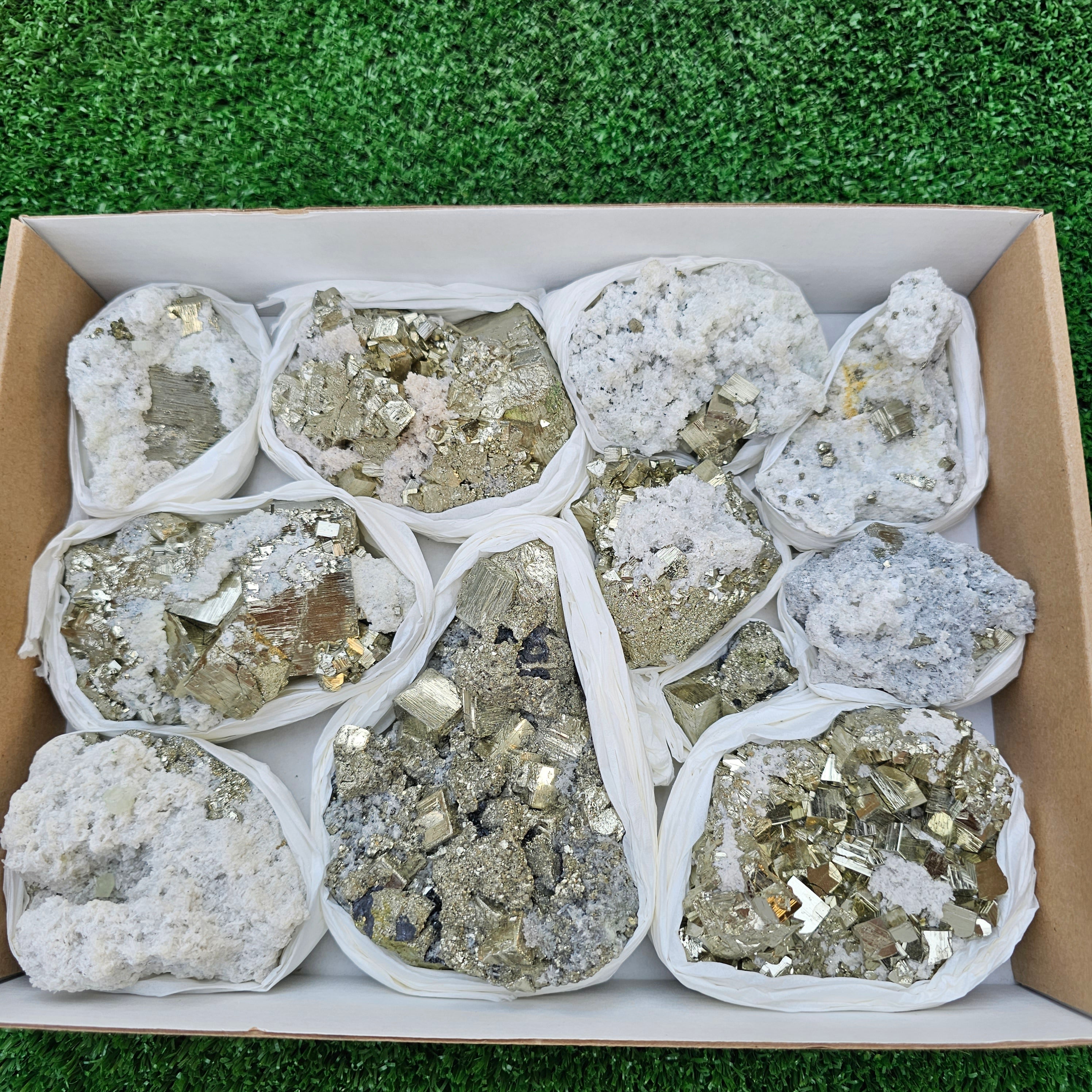 11 pc Pyrite Cubic with calcite flourecent