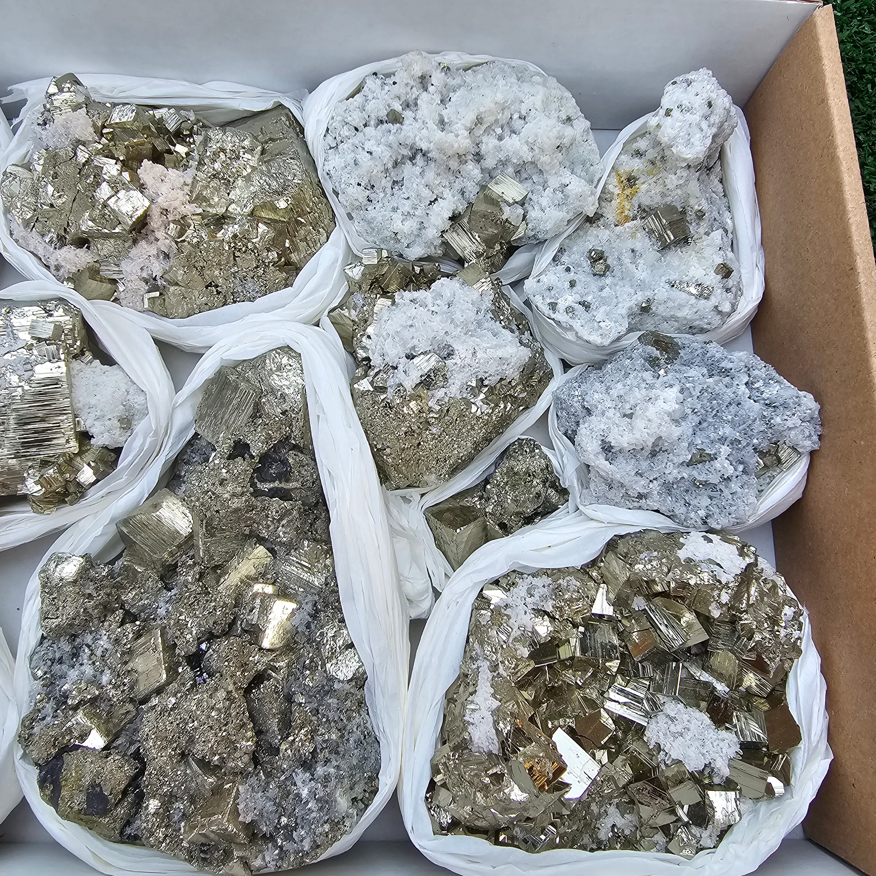 11 pc Pyrite Cubic with calcite flourecent