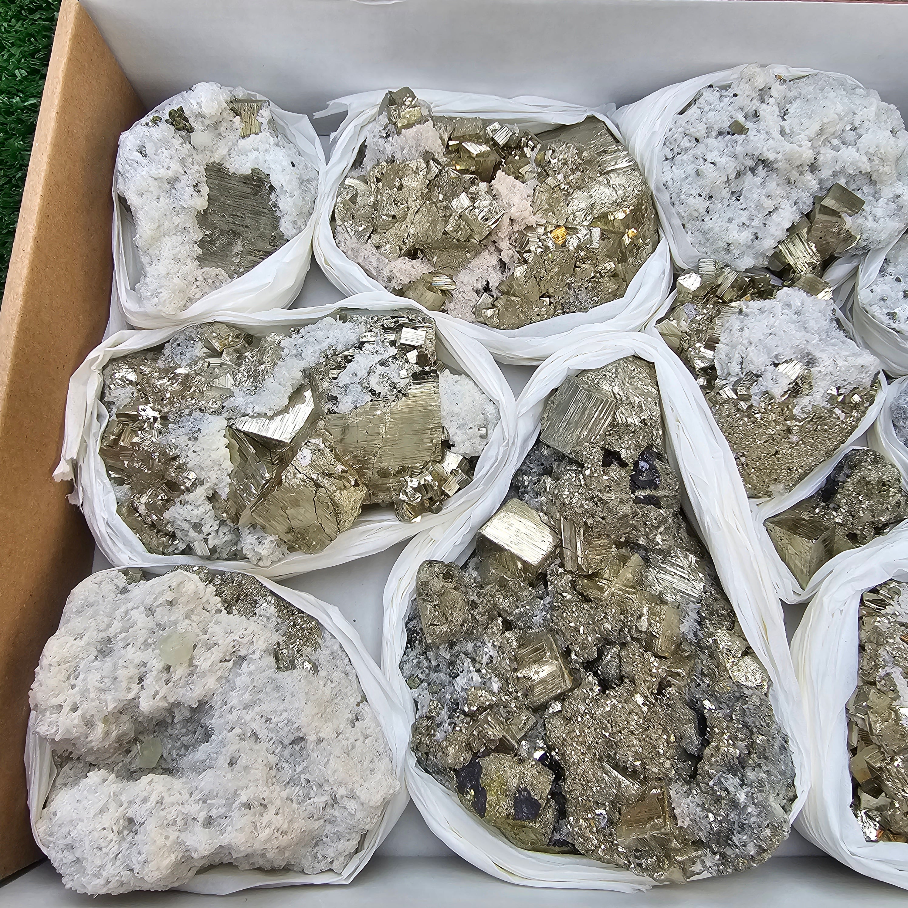 11 pc Pyrite Cubic with calcite flourecent