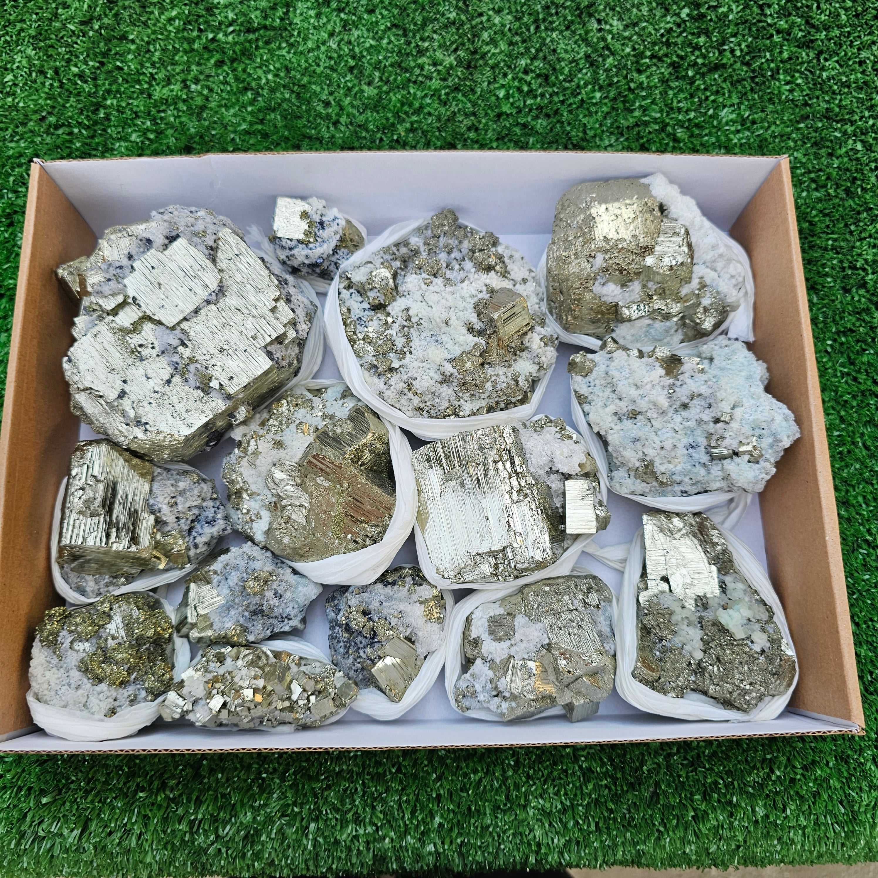 14 pc Pyrite Cubic with calcite flourecent