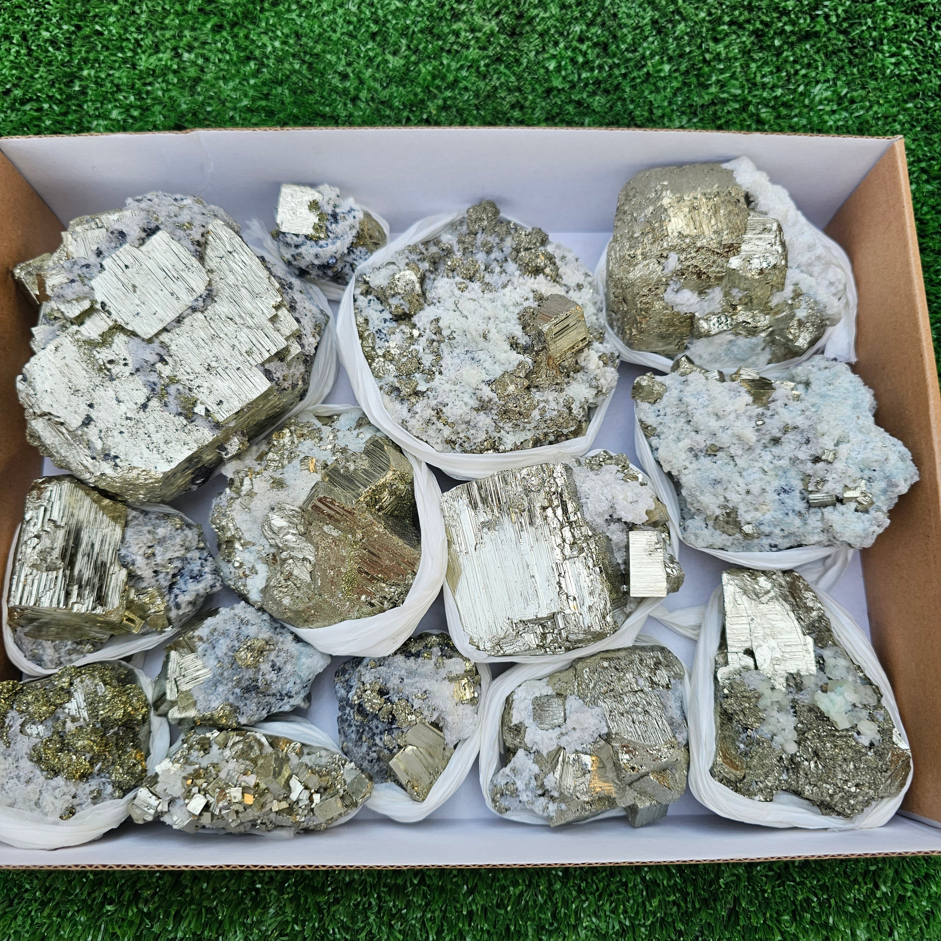 14 pc Pyrite Cubic with calcite flourecent