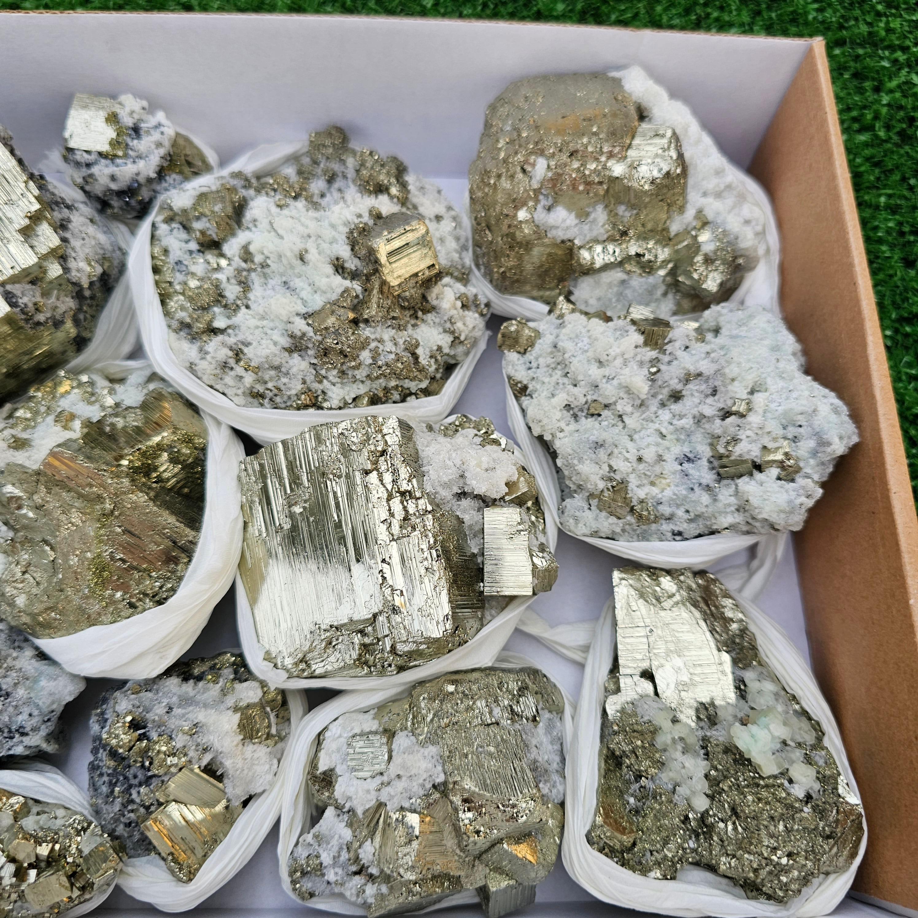 14 pc Pyrite Cubic with calcite flourecent