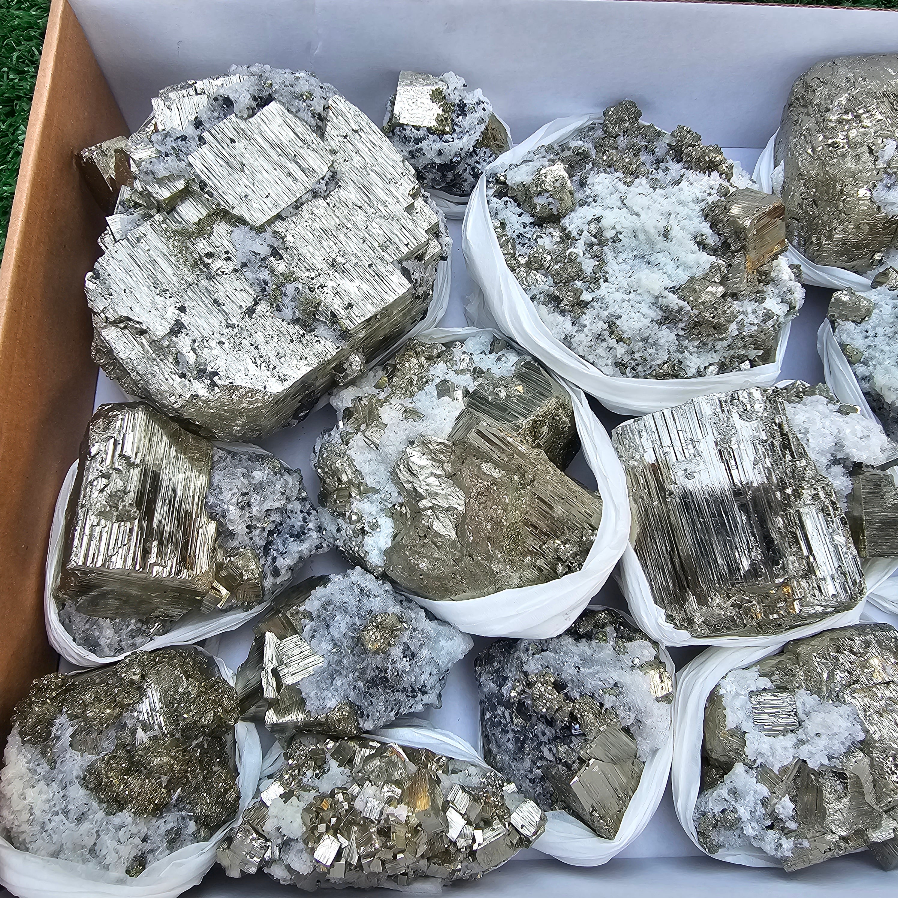 14 pc Pyrite Cubic with calcite flourecent