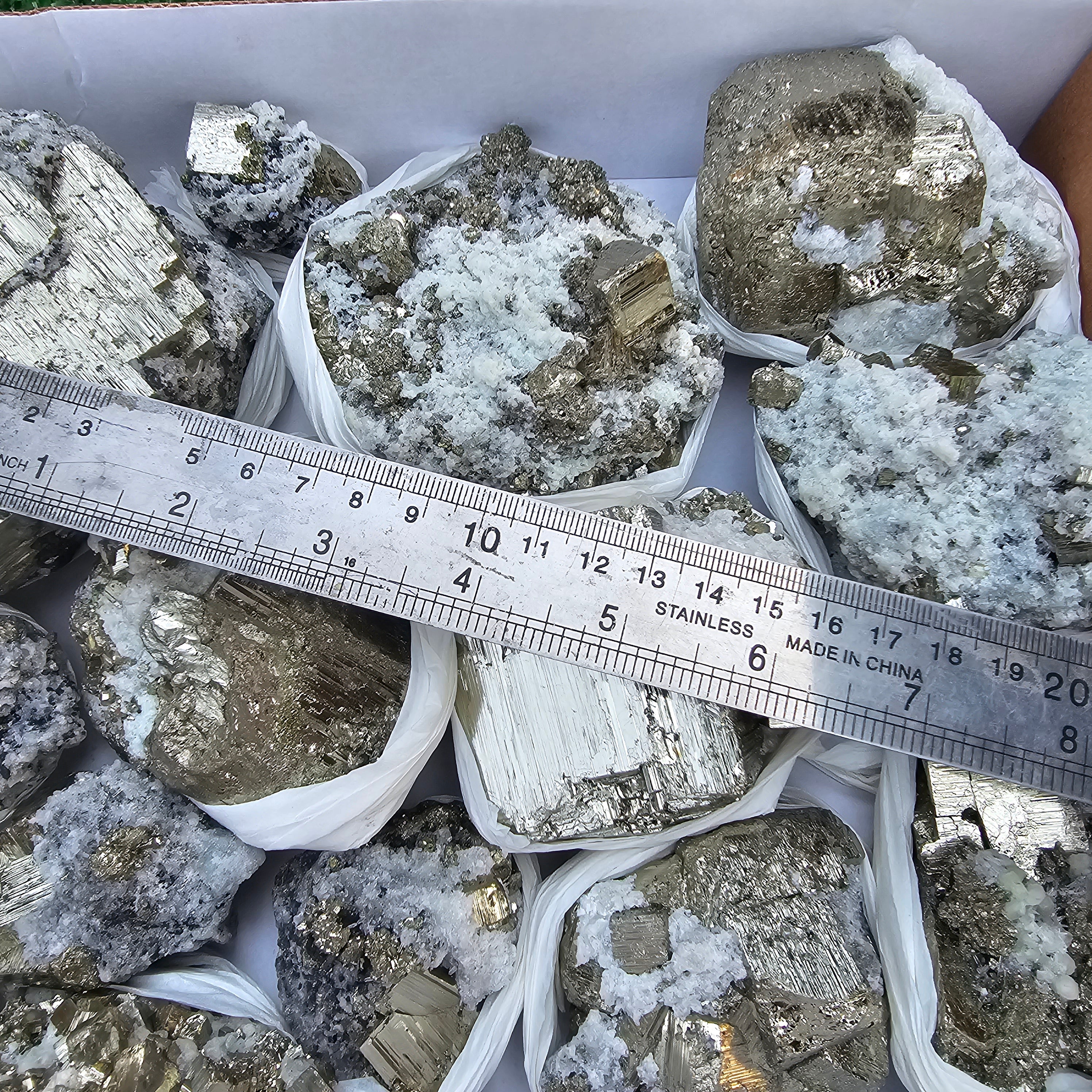 14 pc Pyrite Cubic with calcite flourecent