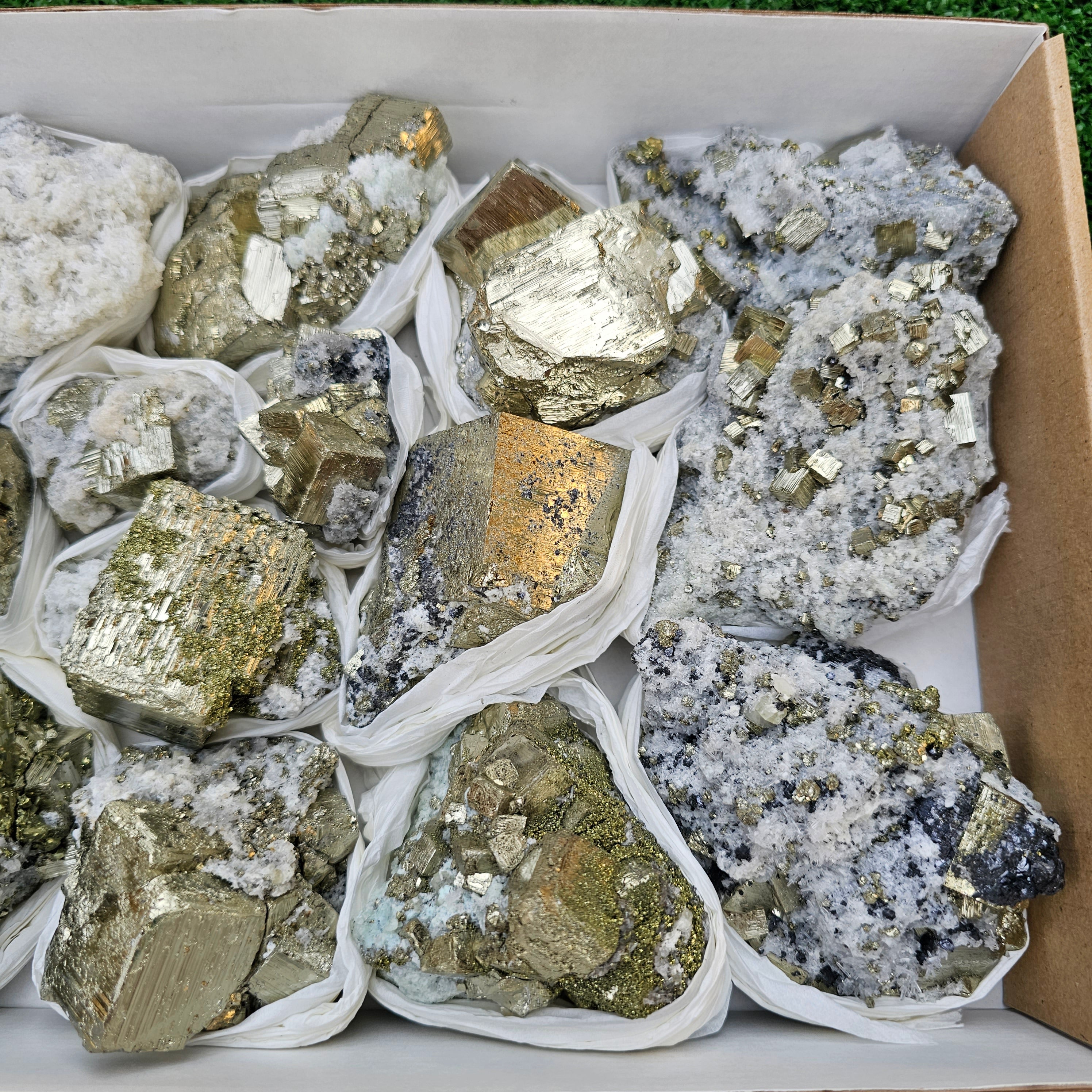 14 pc Pyrite Cubic with calcite flourecent