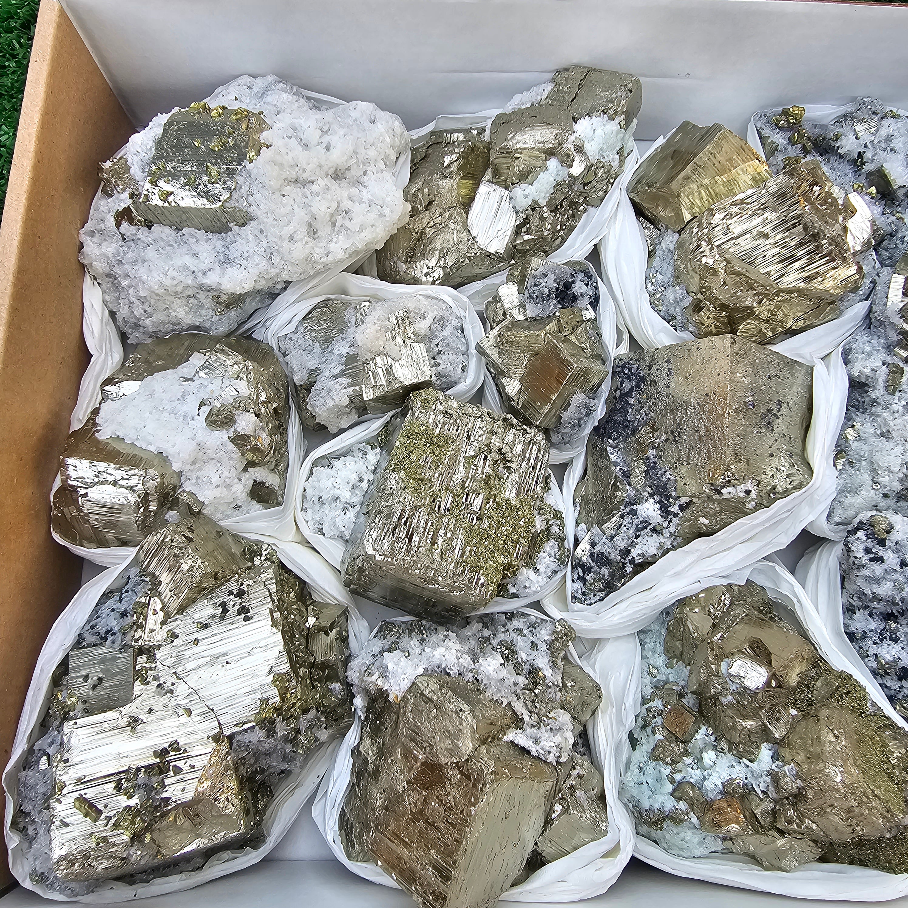 14 pc Pyrite Cubic with calcite flourecent