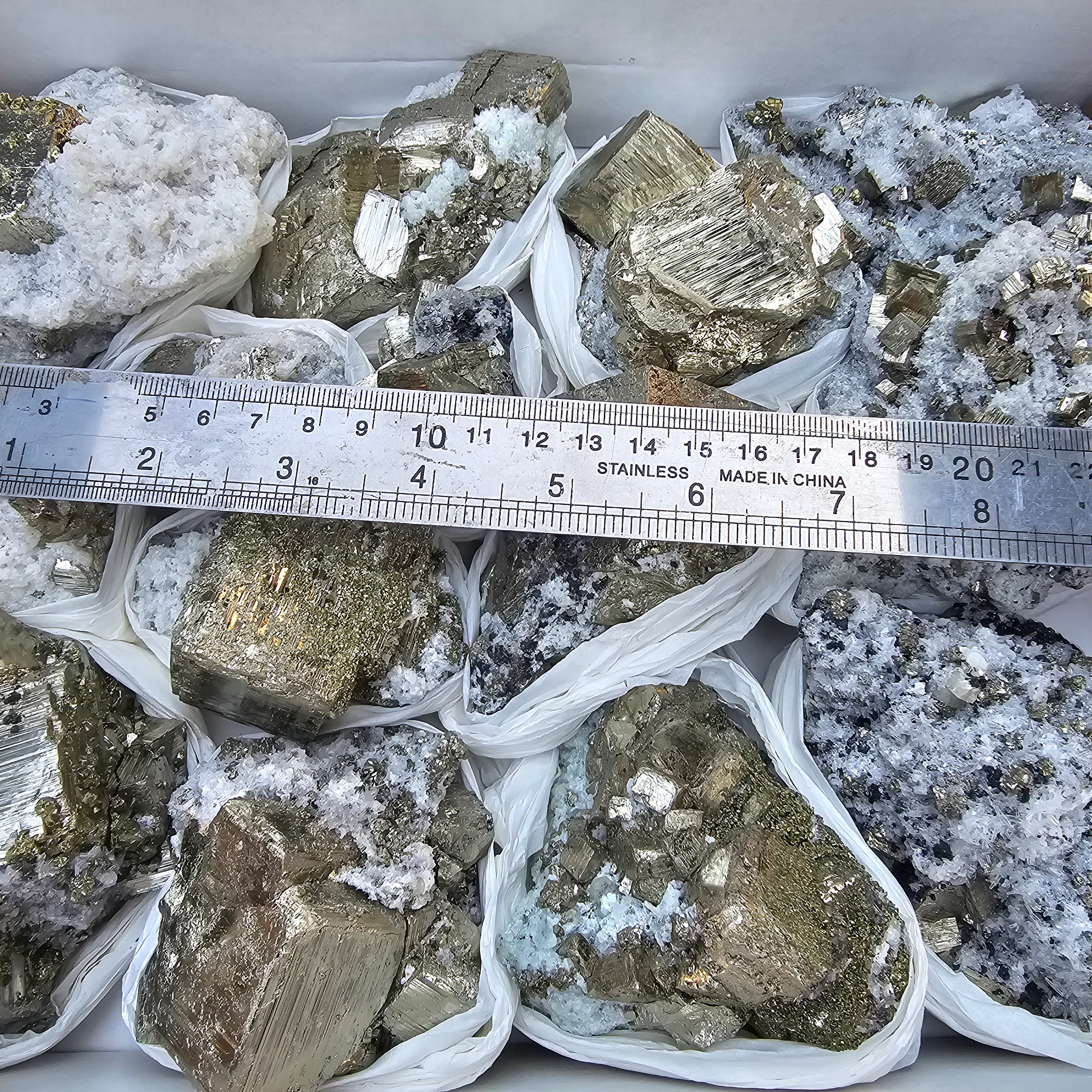 14 pc Pyrite Cubic with calcite flourecent