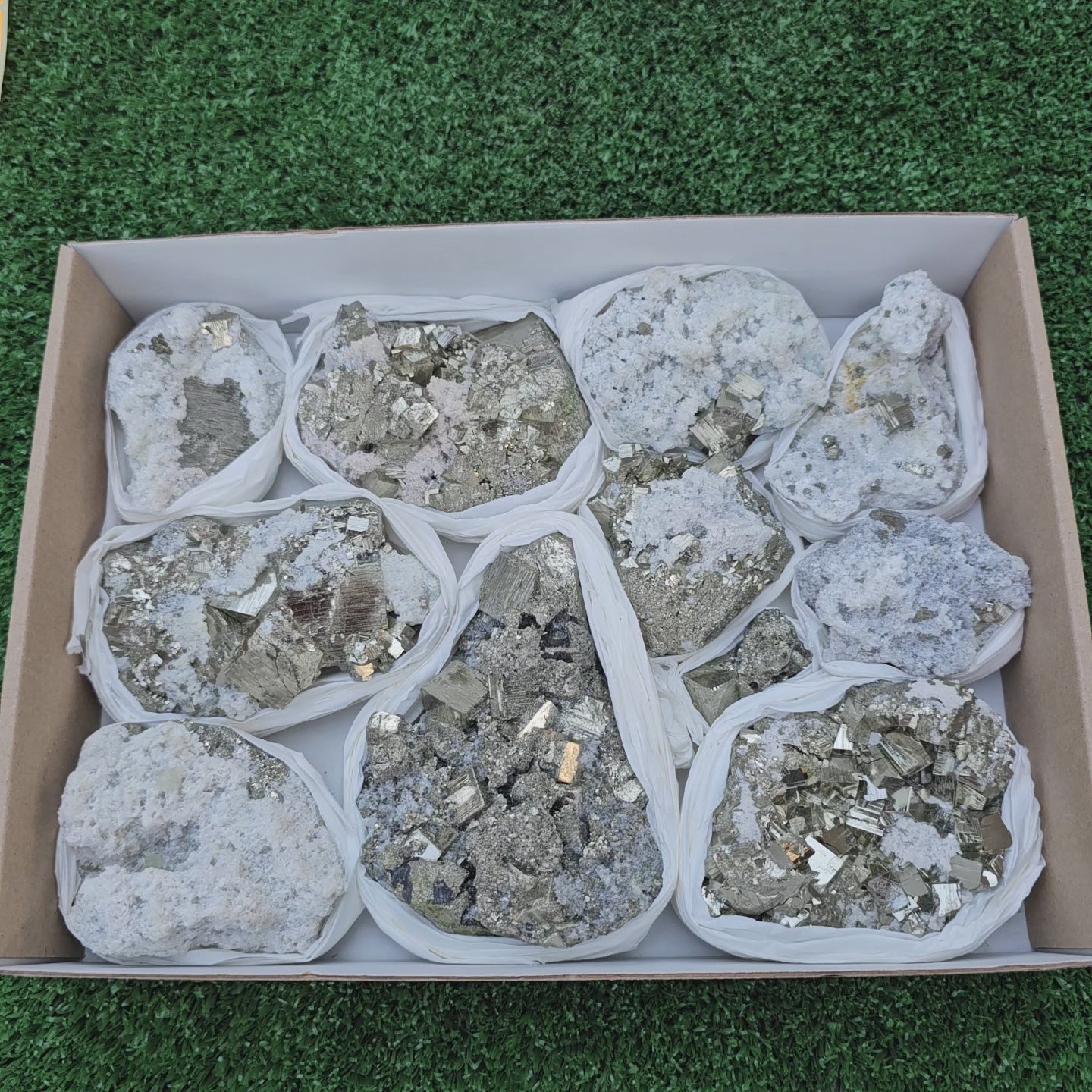 Load video: 11 pc Pyrite Cubic with calcite flourecent