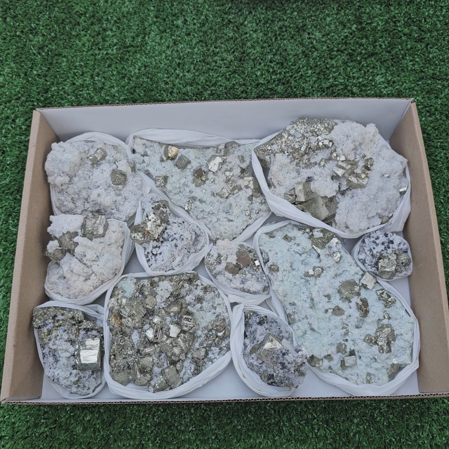 Load video: 12 pc Pyrite Cubic with calcite flourecent