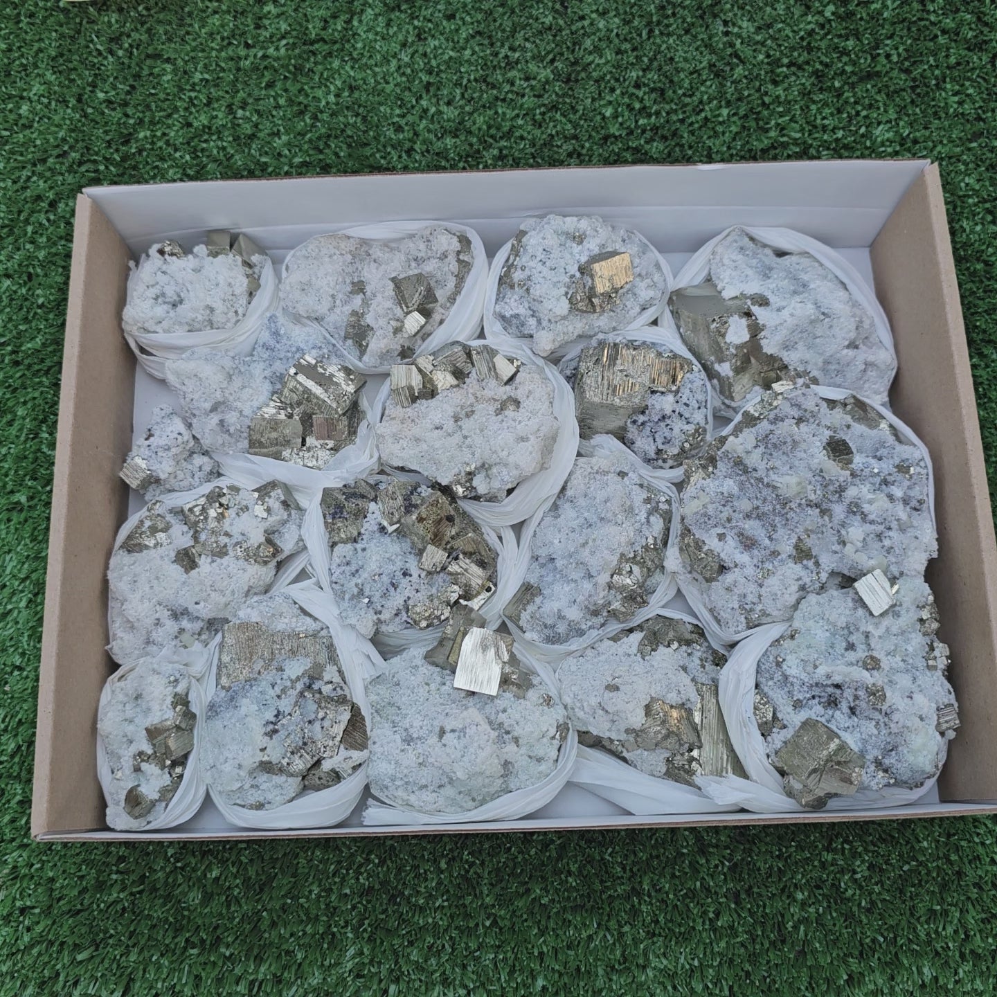 Load video: 17 pc Pyrite Cubic with calcite flourecent