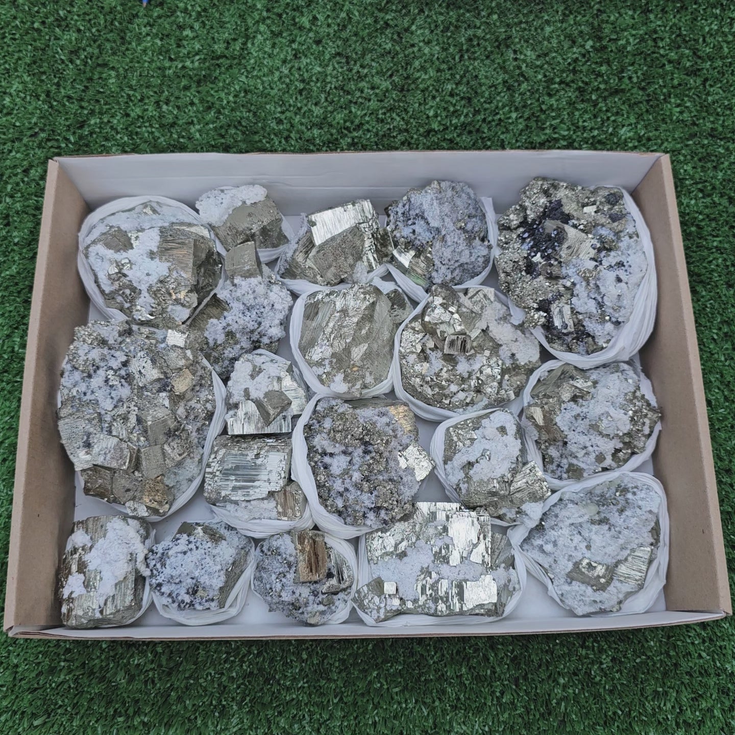 Load video: 19 pc Pyrite Cubic with calcite flourecent