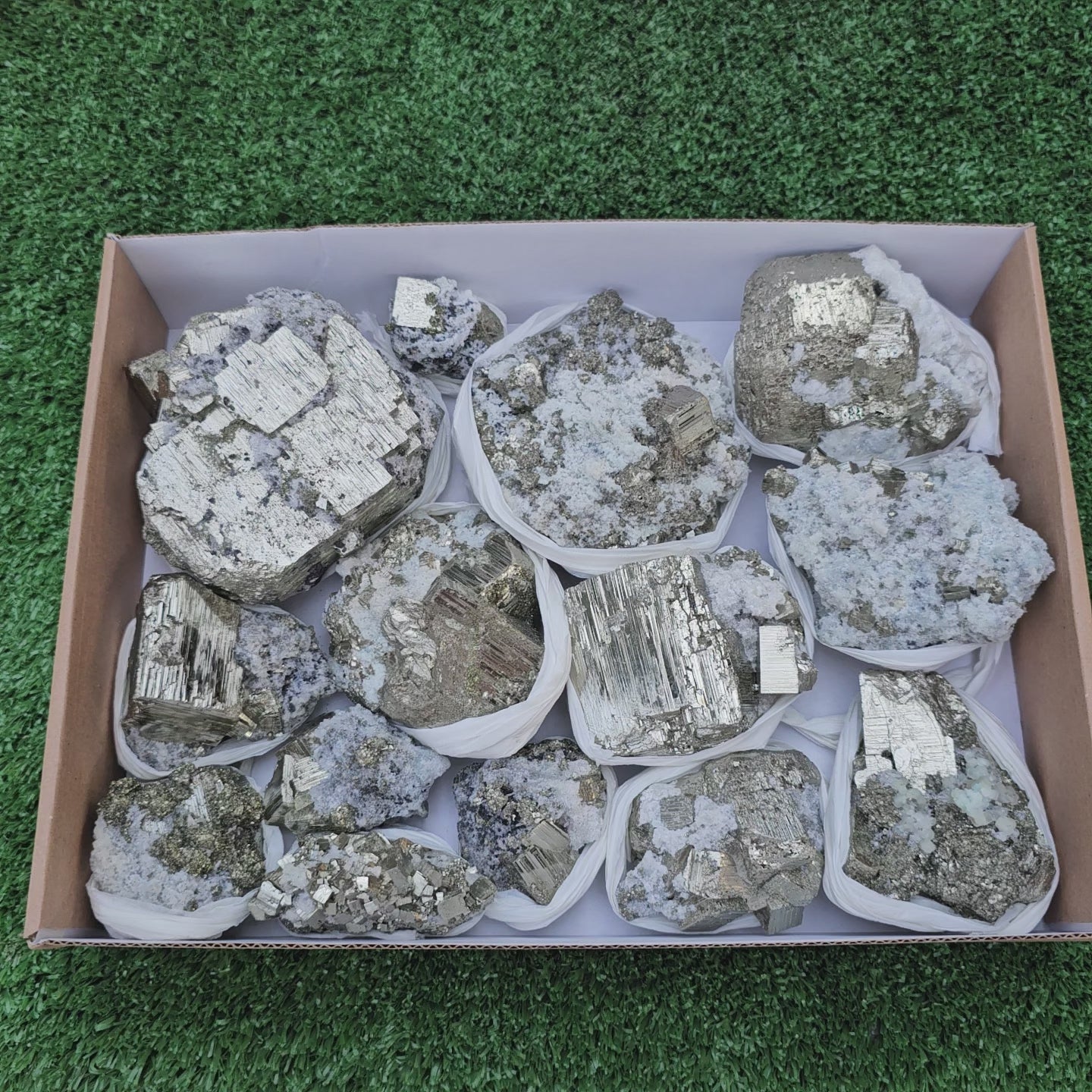 Load video: 14 pc Pyrite Cubic with calcite flourecent