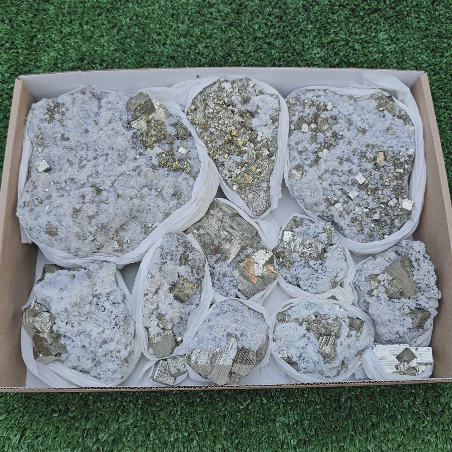 Load video: 11 pc Pyrite Cubic with calcite flourecent