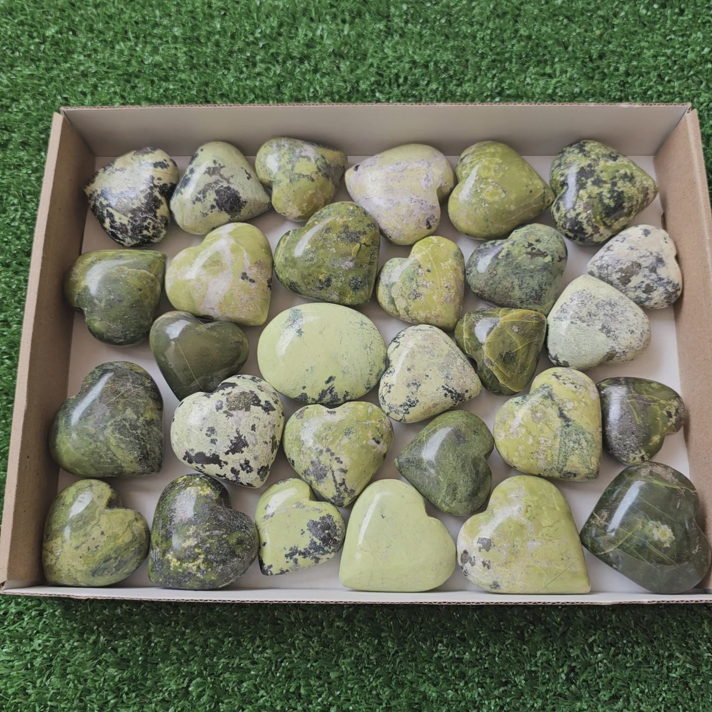 Load video: 20 pc green serpentine hearts