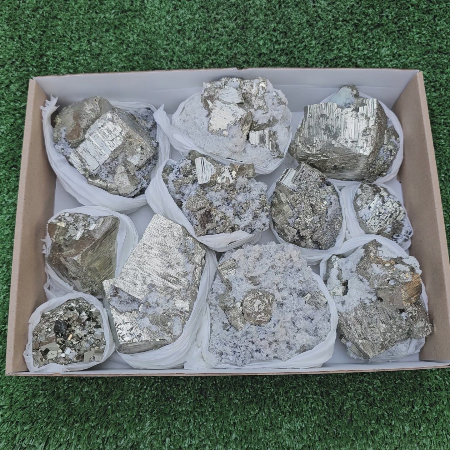 Load video: 11 pc Pyrite Cubic with calcite flourecent