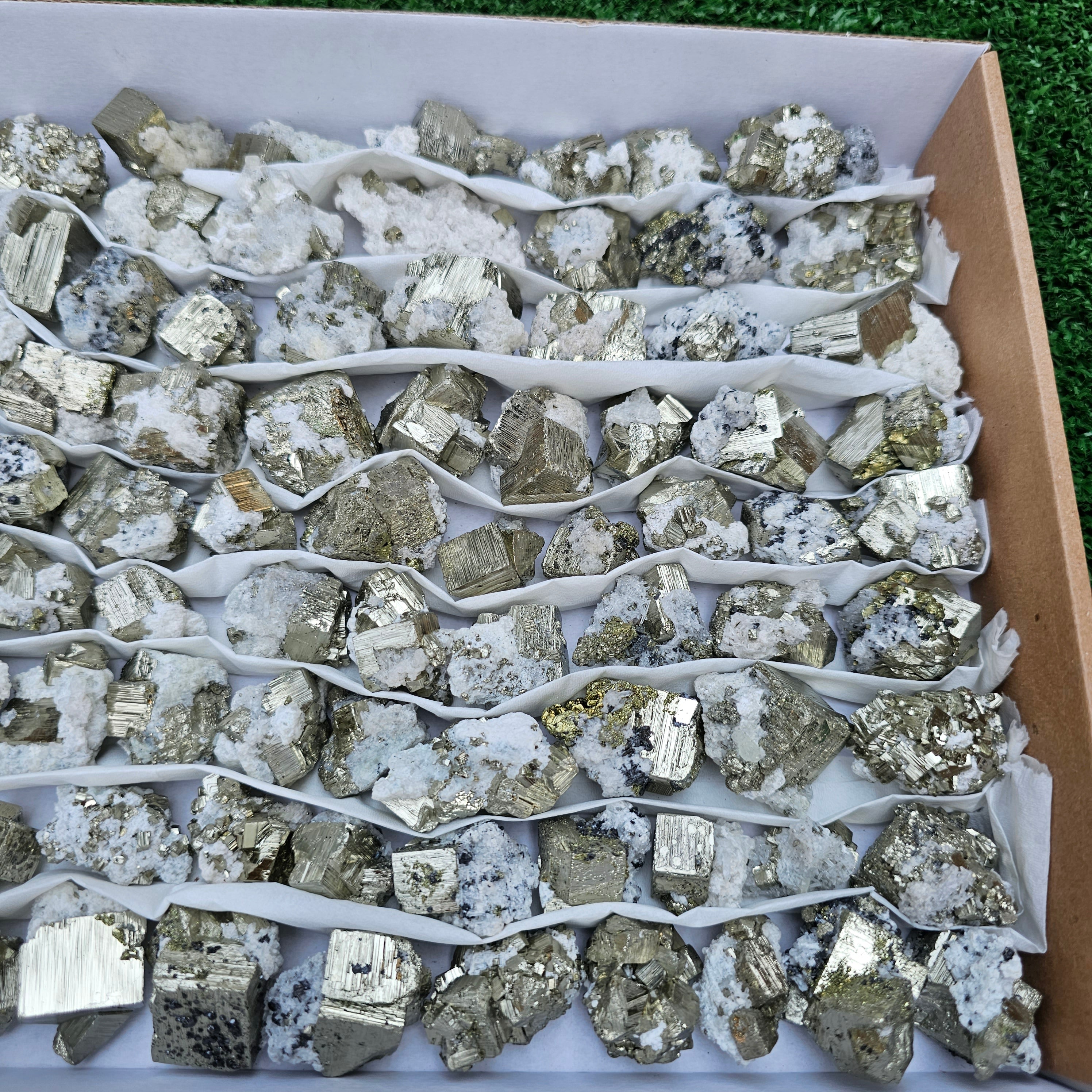84 pc Box Pyrite Cubic with calcite flourecent