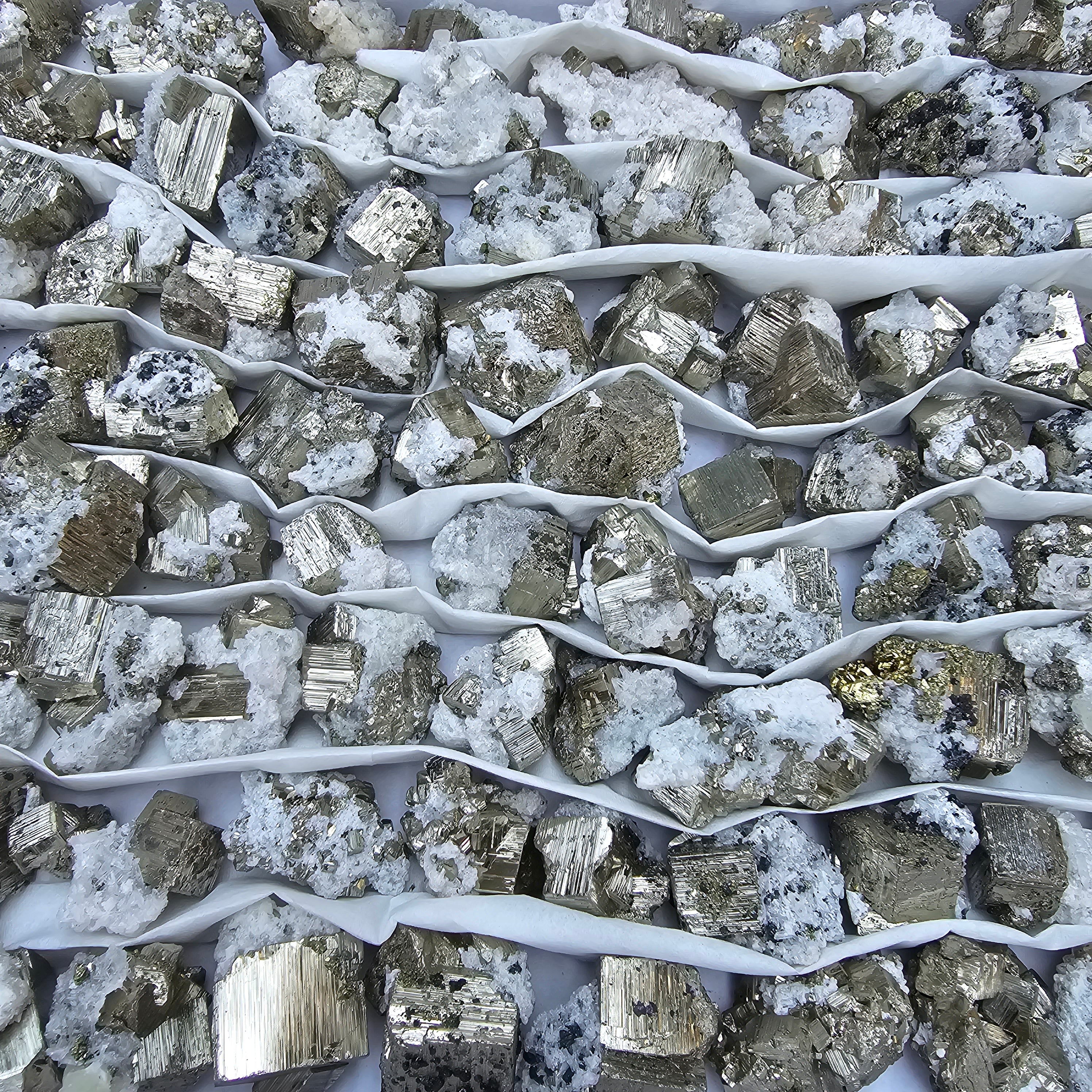 84 pc Box Pyrite Cubic with calcite flourecent