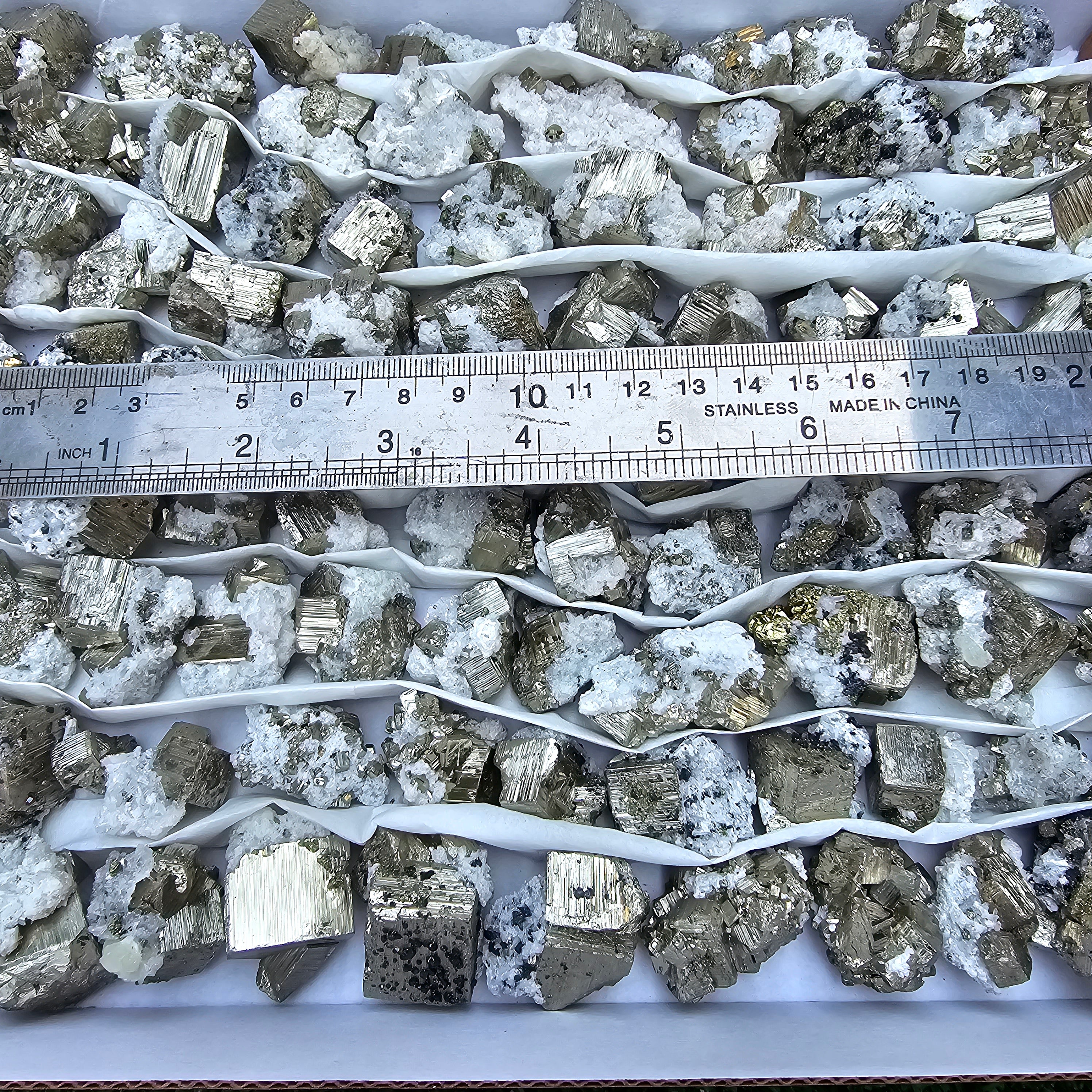 84 pc Box Pyrite Cubic with calcite flourecent