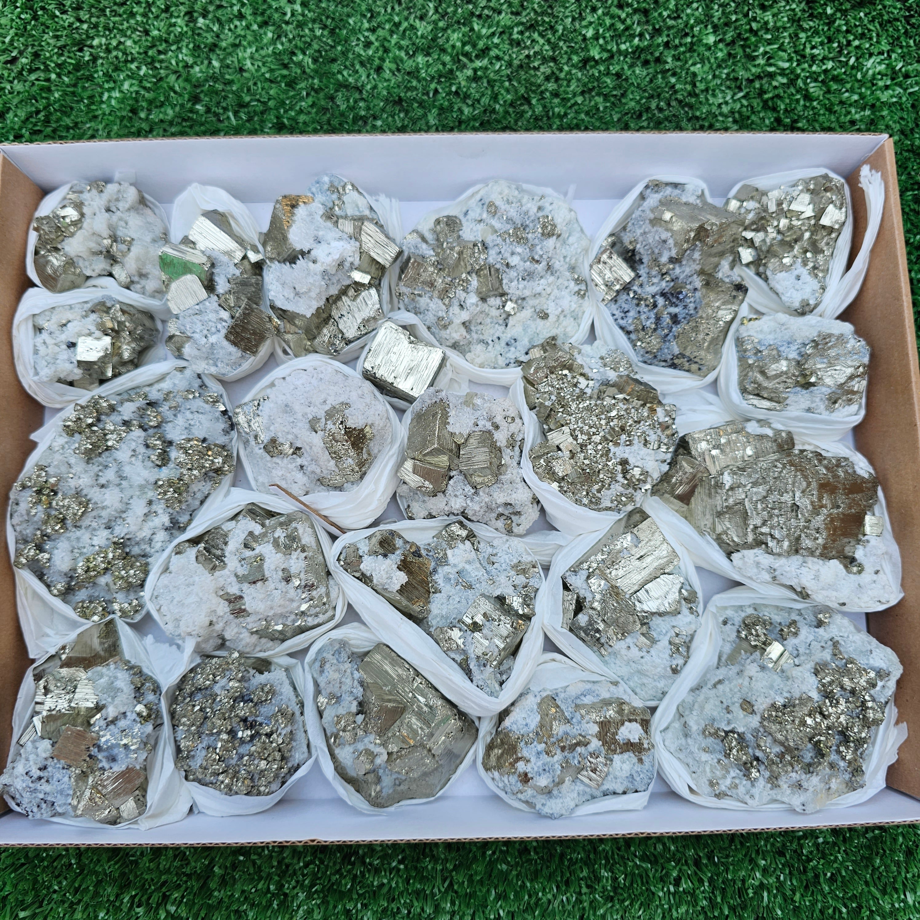22 pc Box Pyrite Cubic with calcite flourecent