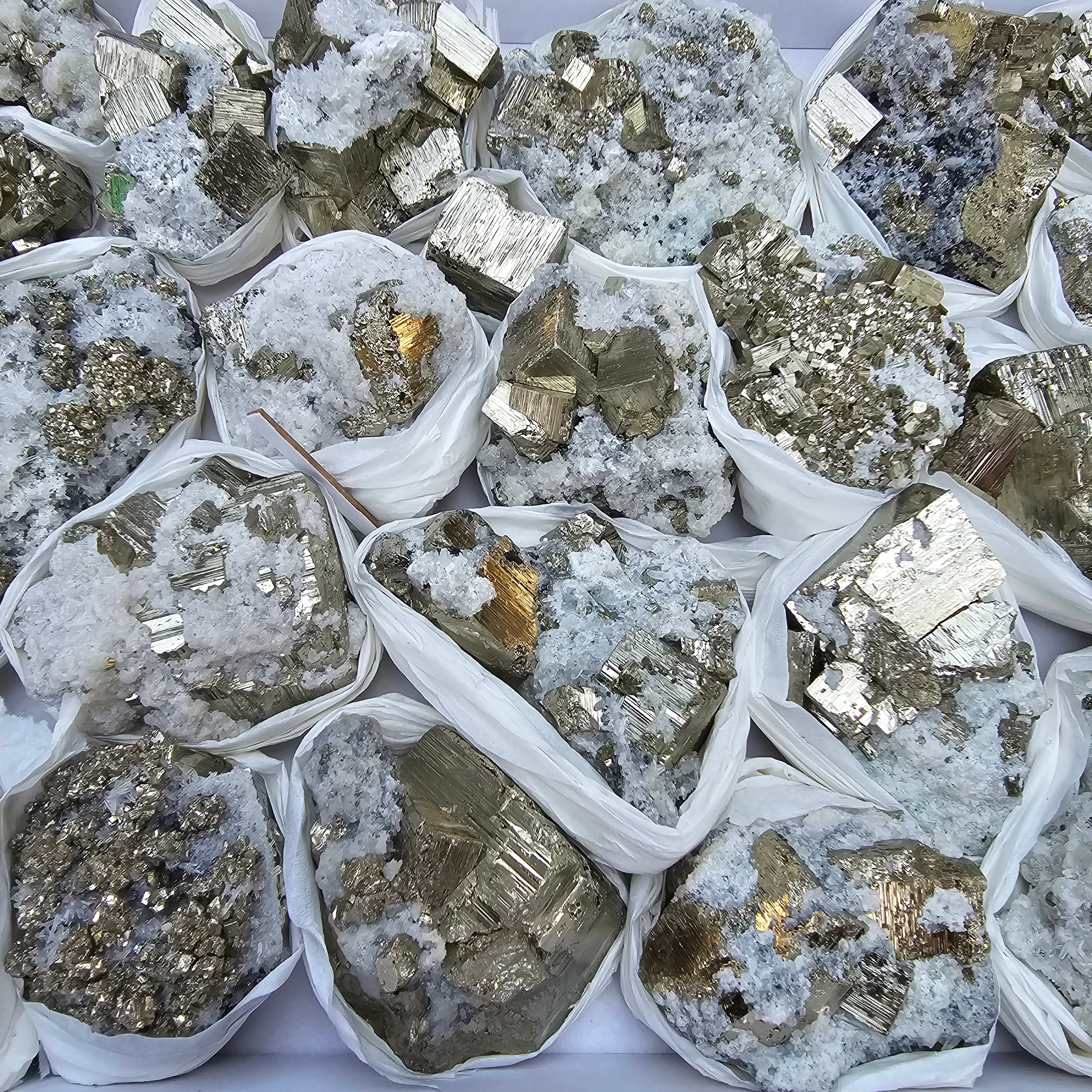 22 pc Box Pyrite Cubic with calcite flourecent