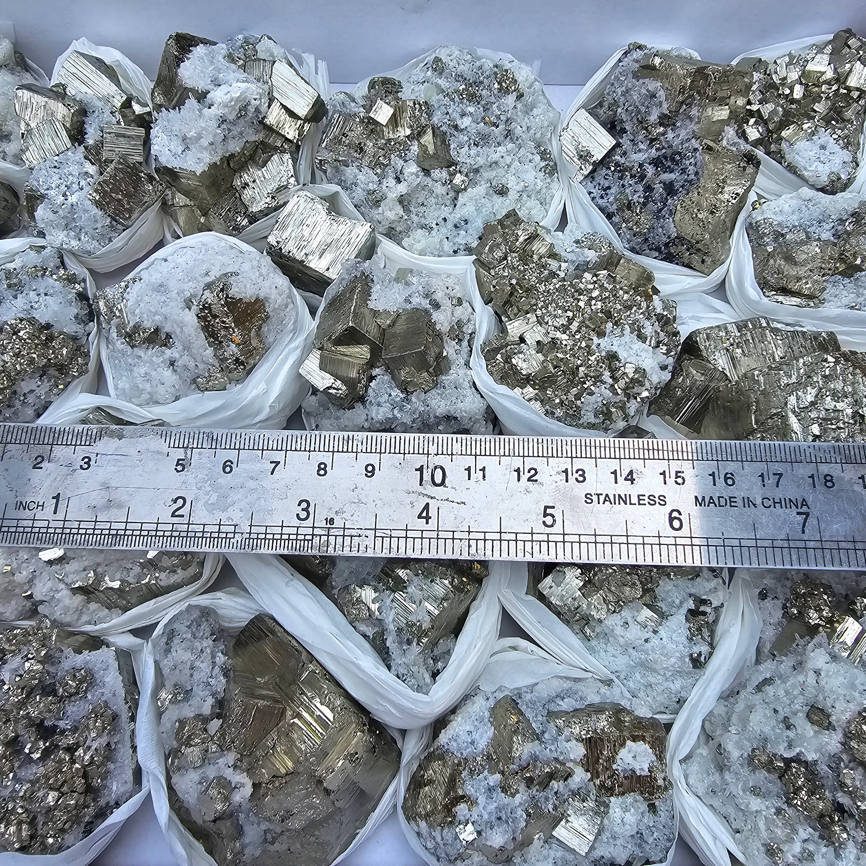 22 pc Box Pyrite Cubic with calcite flourecent