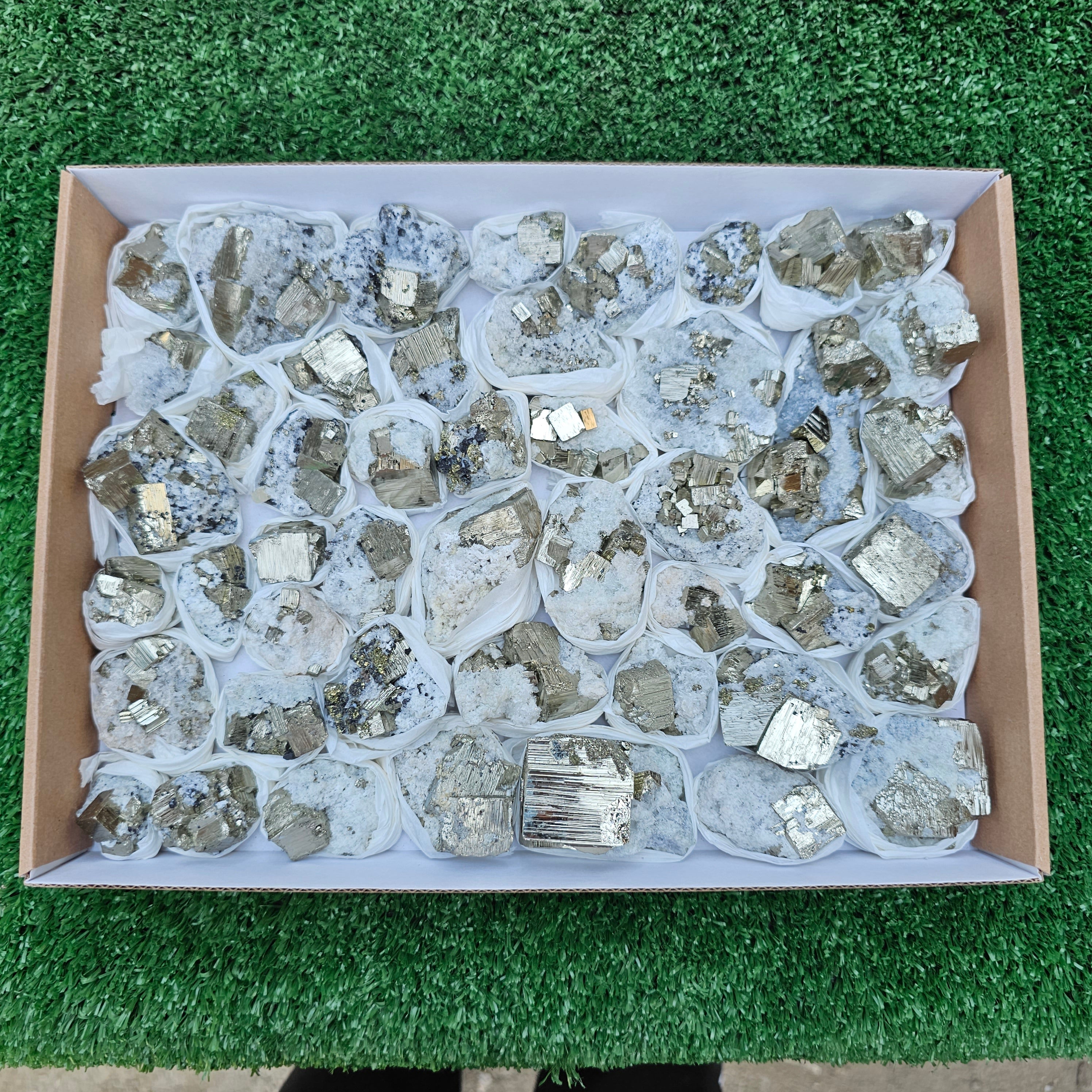 48 pc Pyrite Cubic with calcite flourecent